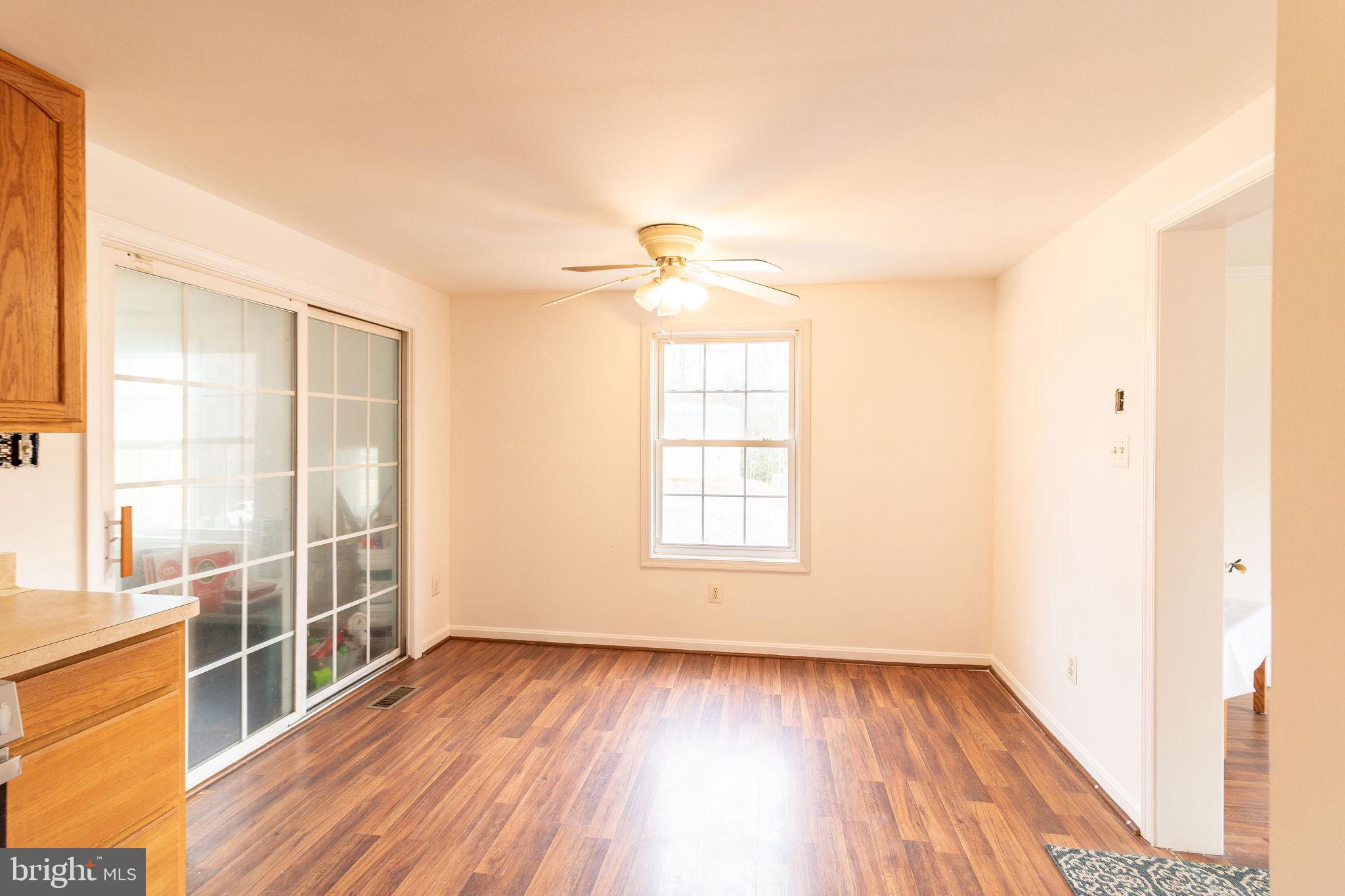 16 Eley Road Fredericksburg, VA 22406 - Photo 12 of 16 a view of an empty room with wooden floor and a window