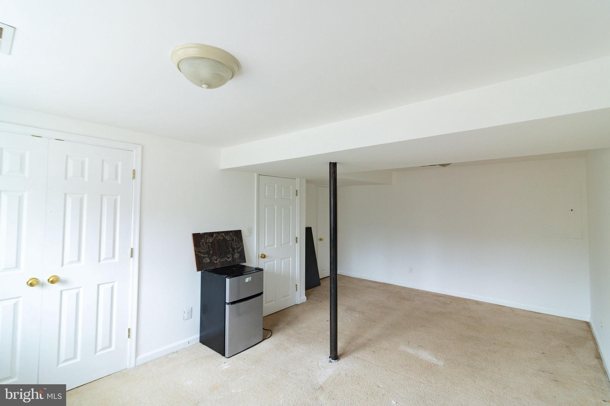 16 Eley Road Fredericksburg, VA 22406 - Photo 15 of 16 a living room with furniture and a flat screen tv