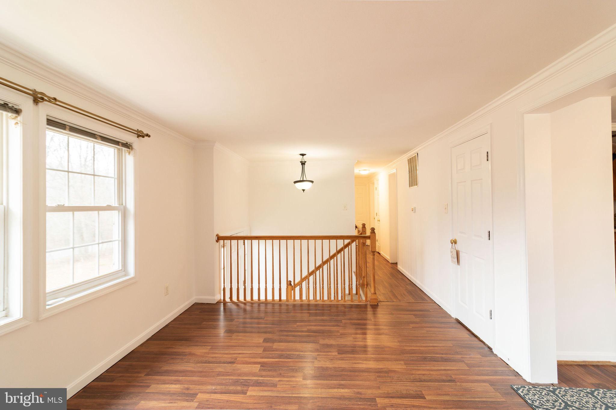 16 Eley Road Fredericksburg, VA 22406 - Photo 3 of 16 a view of a room with wooden floor and windows