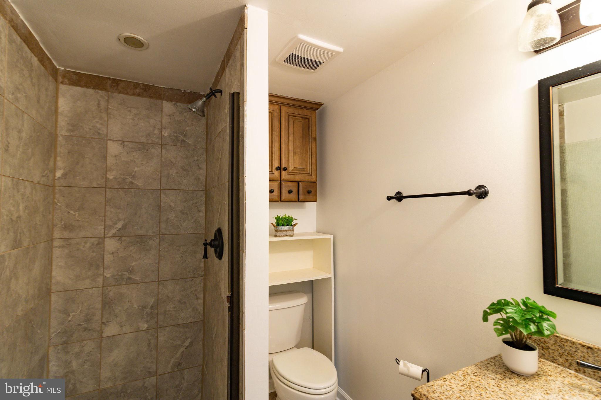 16 Eley Road Fredericksburg, VA 22406 - Photo 10 of 16 a bathroom with a toilet and a shower