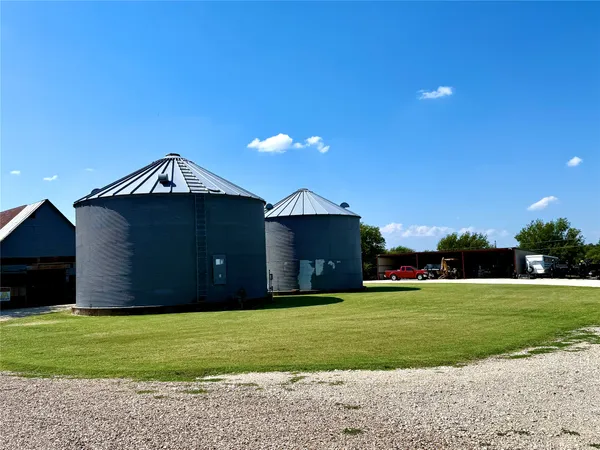 a bedroom with bed and a chandelier