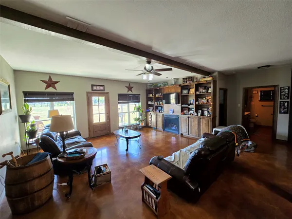 a kitchen with stainless steel appliances granite countertop a stove top oven a sink dishwasher and cabinets with wooden floor