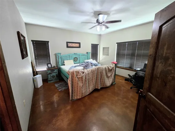 a large room with kitchen island granite countertop lots of counter top space