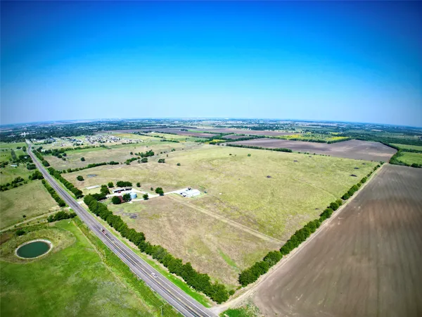 a view of a pool an outdoor seating