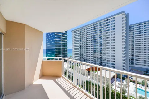 a view of balcony with furniture