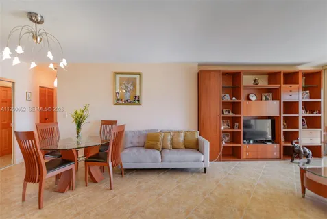 a living room with furniture and lamp