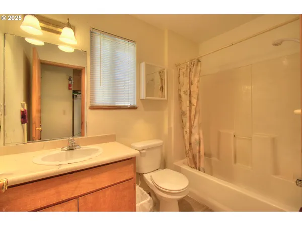 a bedroom with a bed and a book shelf
