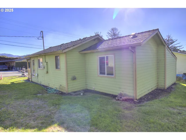 a view of backyard of house with entertaining space