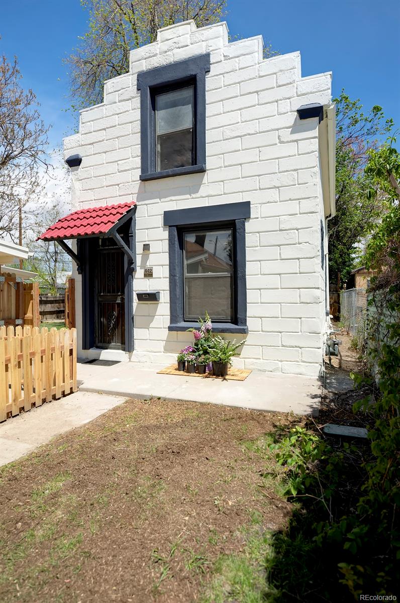 442 Inca Street Denver, CO 80204 - Photo 1 of 1 a front view of a house with a yard