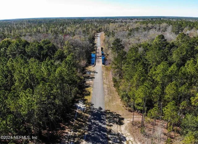 a view of swimming pool with yard and outdoor seating