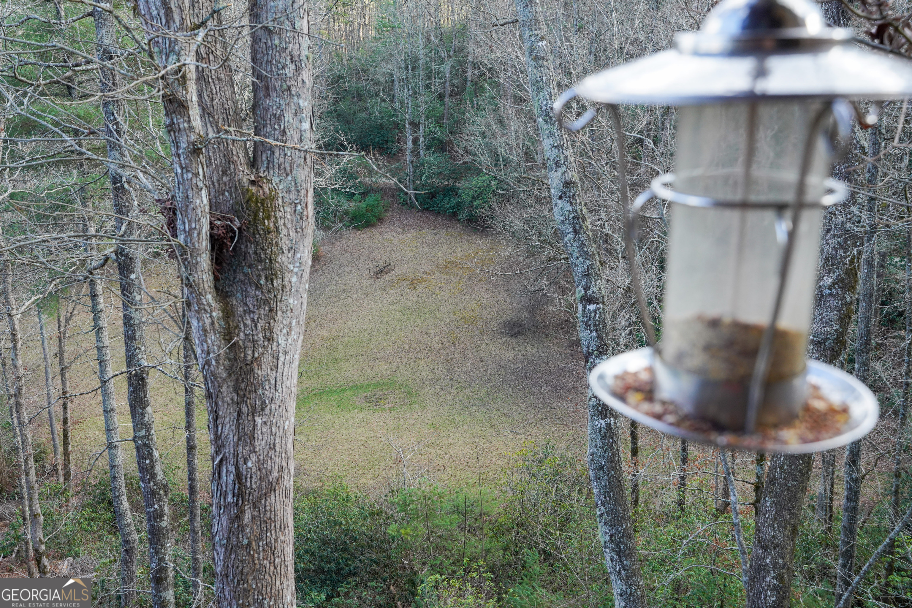 5232 Crow Creek Road Lakemont, GA 30552 - Photo 13 of 90 a backyard of a house with table and chairs