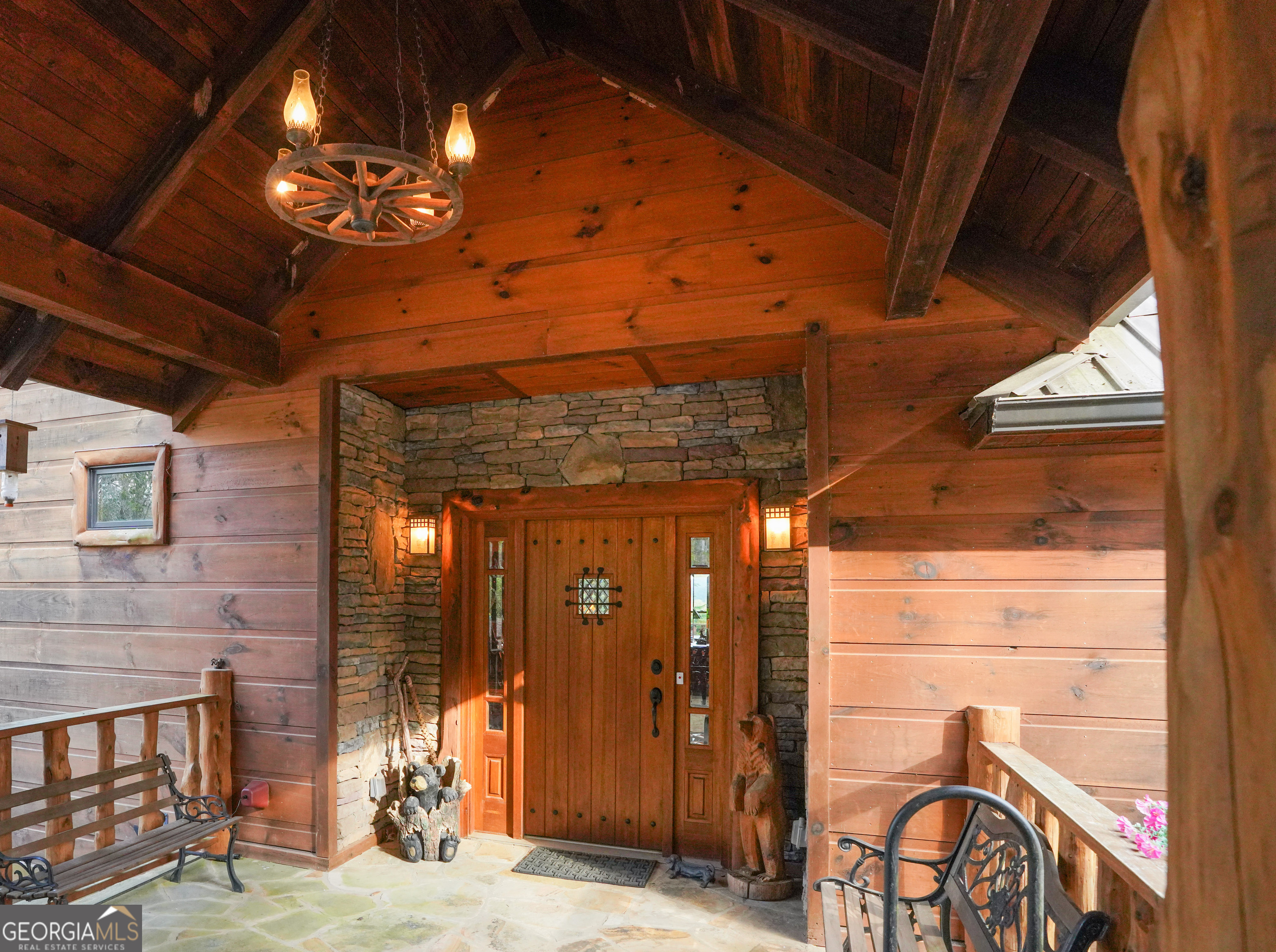 5232 Crow Creek Road Lakemont, GA 30552 - Photo 18 of 90 a view of a porch with a table and chairs