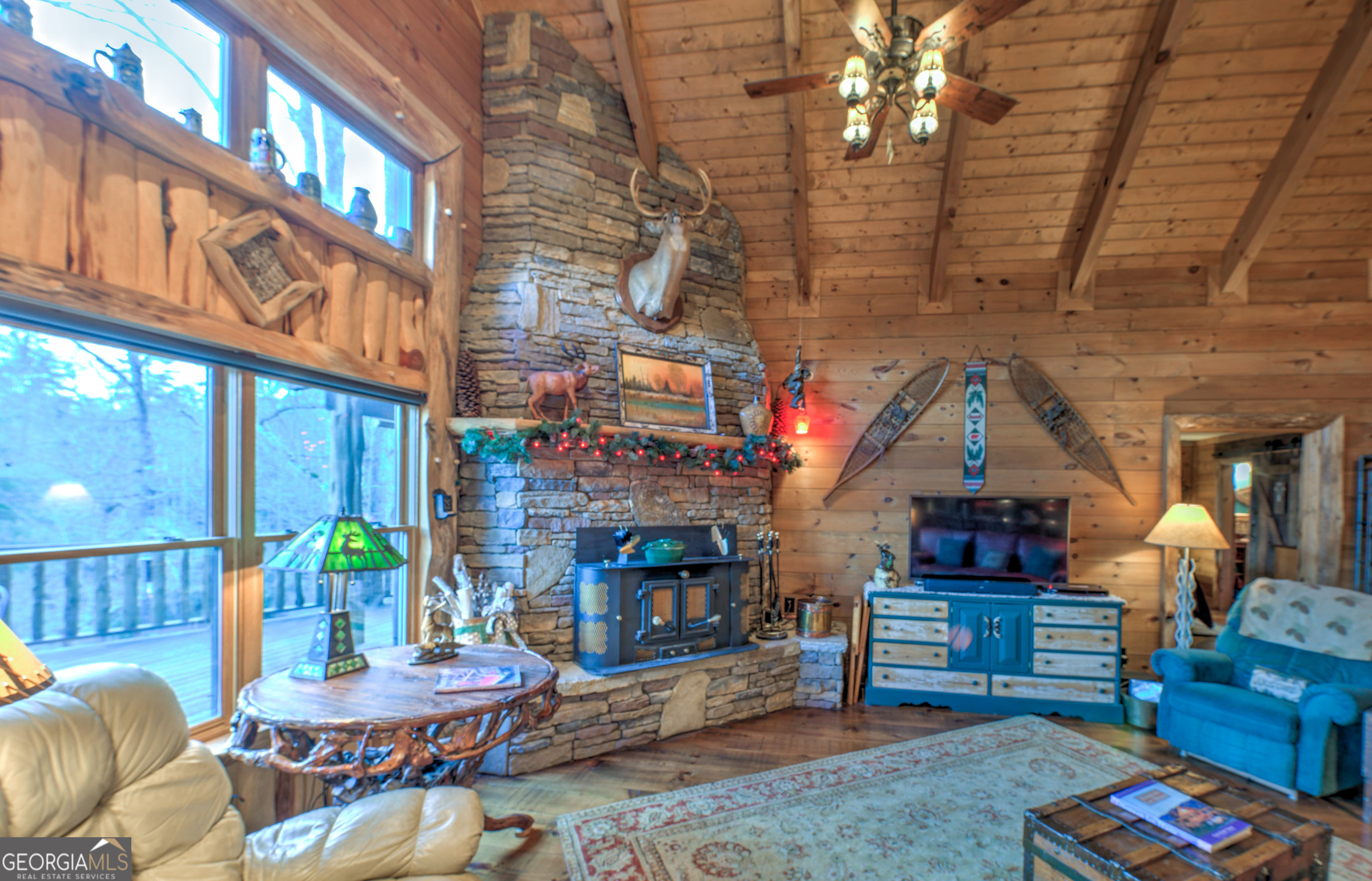 5232 Crow Creek Road Lakemont, GA 30552 - Photo 23 of 90 a living room with fireplace furniture and a wooden floor