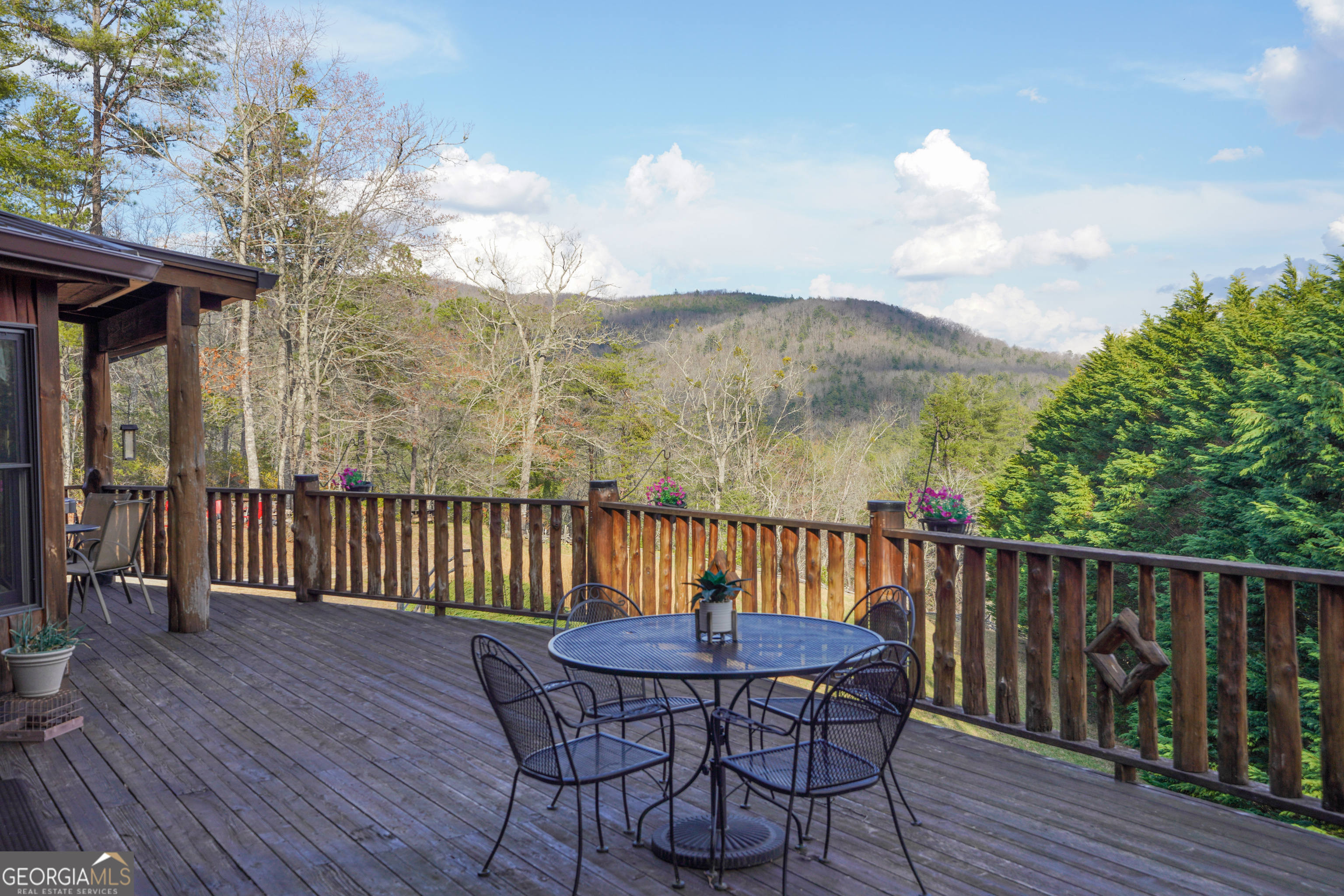 5232 Crow Creek Road Lakemont, GA 30552 - Photo 3 of 90 a view of a chairs on the roof deck