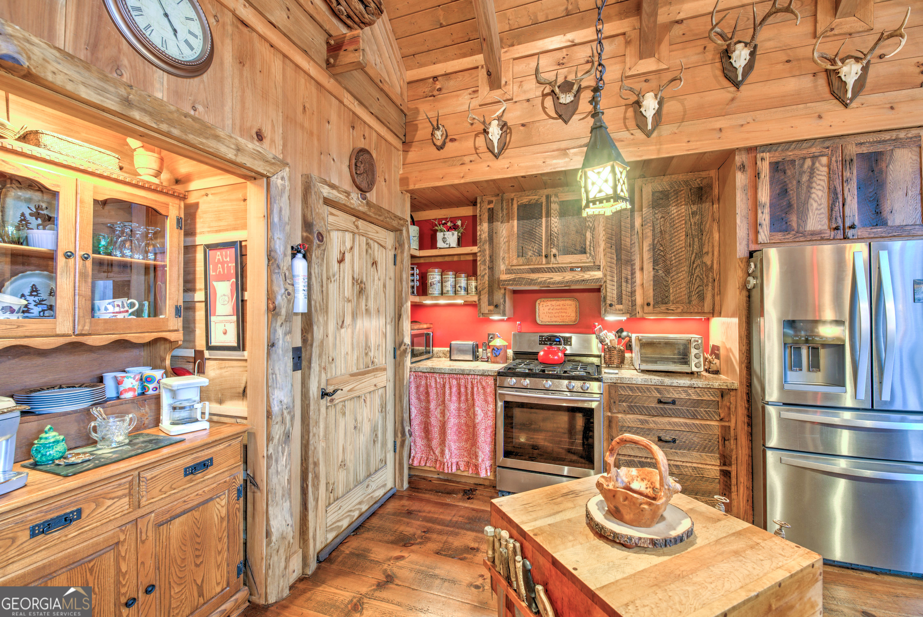 5232 Crow Creek Road Lakemont, GA 30552 - Photo 34 of 90 a kitchen with stainless steel appliances granite countertop a stove and a refrigerator
