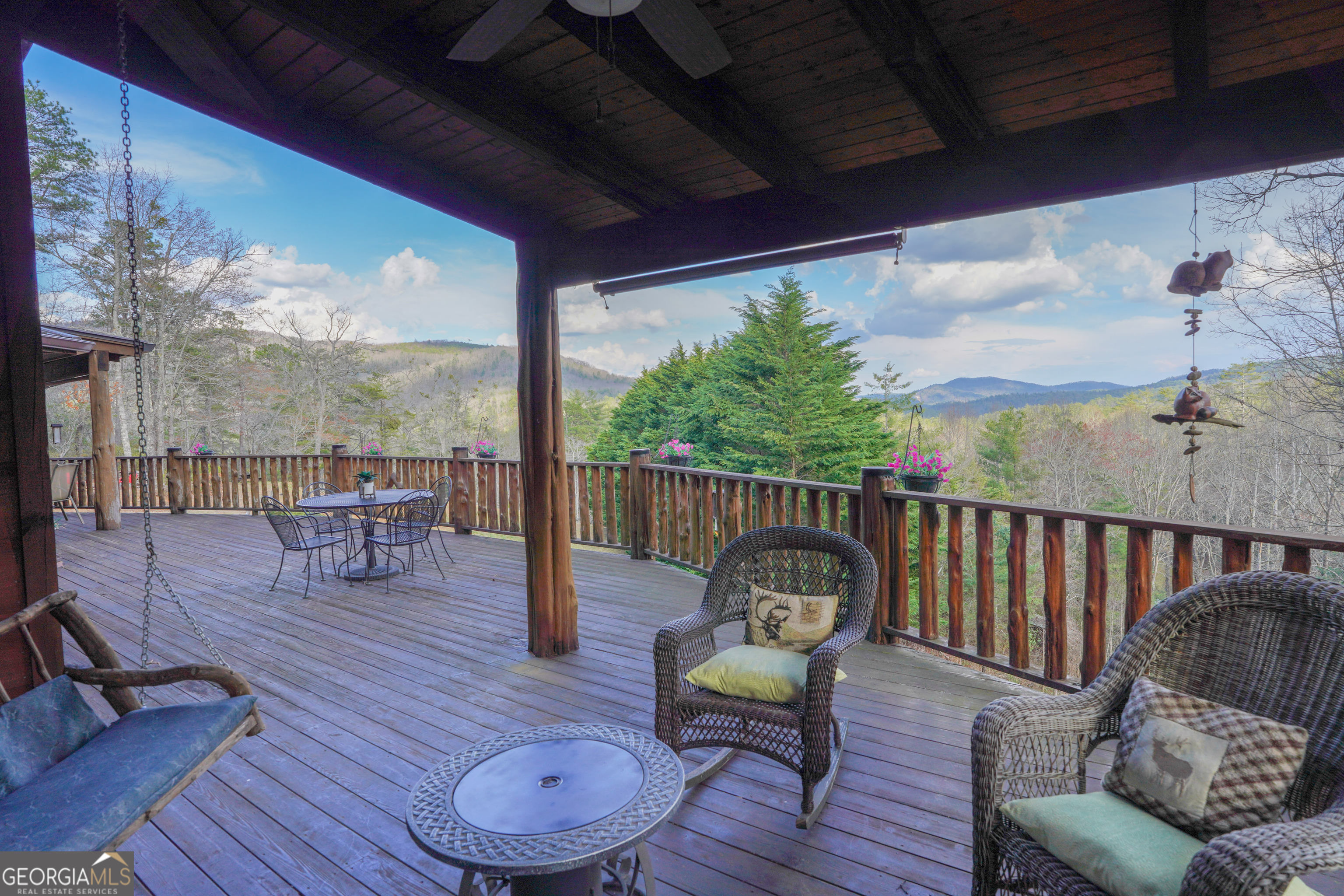 5232 Crow Creek Road Lakemont, GA 30552 - Photo 46 of 90 a view of a porch with furniture and wooden floor