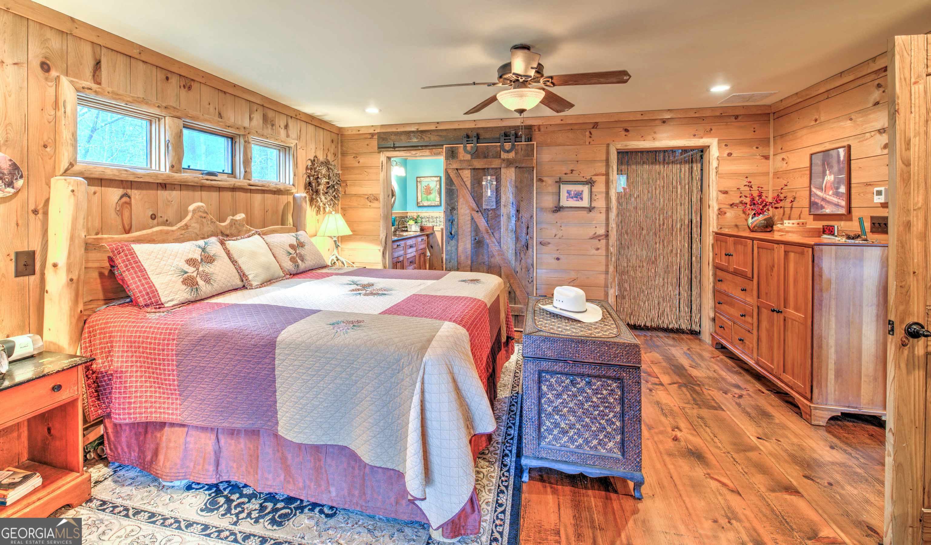 5232 Crow Creek Road Lakemont, GA 30552 - Photo 48 of 90 a bedroom with a bed and wooden floor