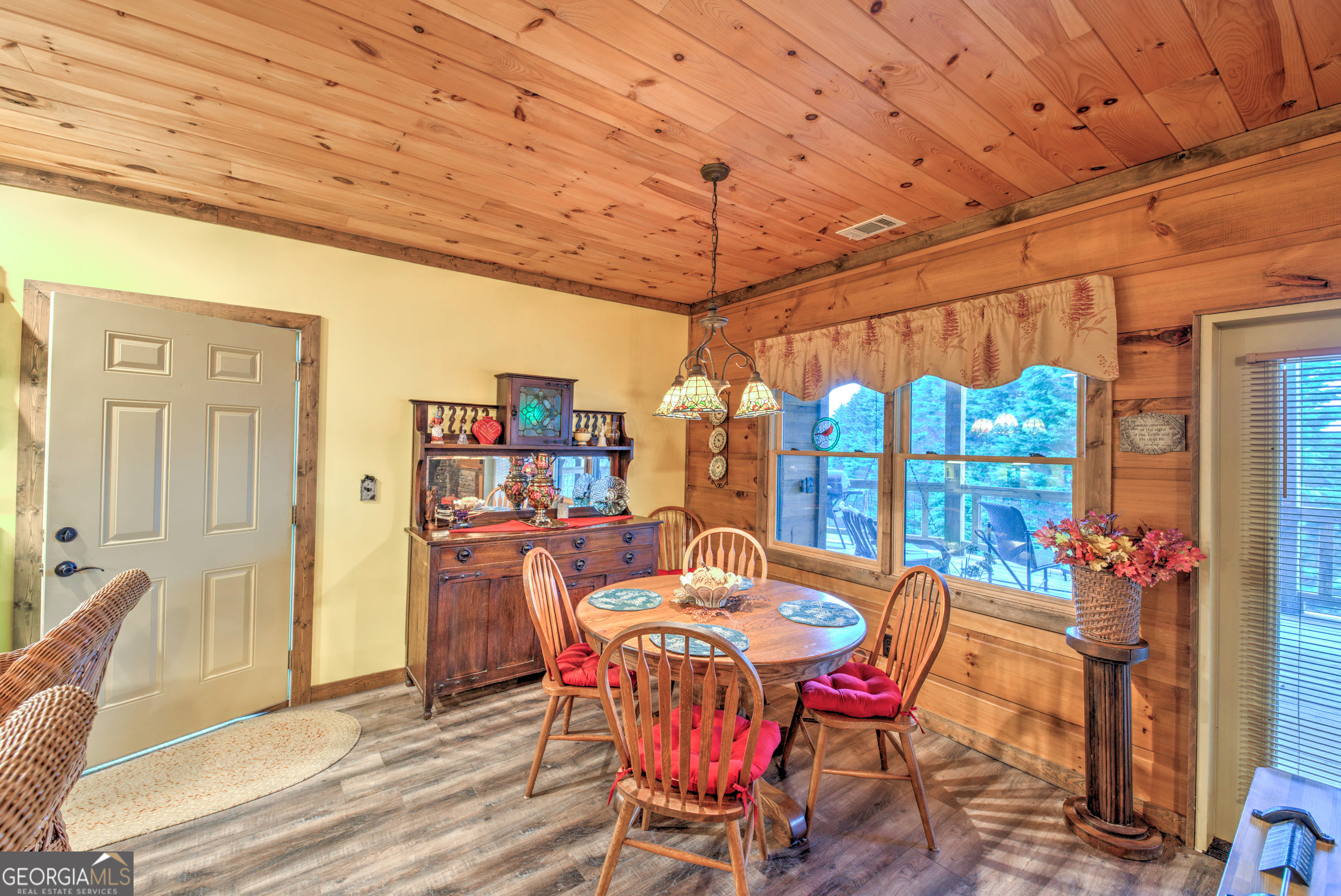 5232 Crow Creek Road Lakemont, GA 30552 - Photo 64 of 90 a dining room with furniture and wooden floor