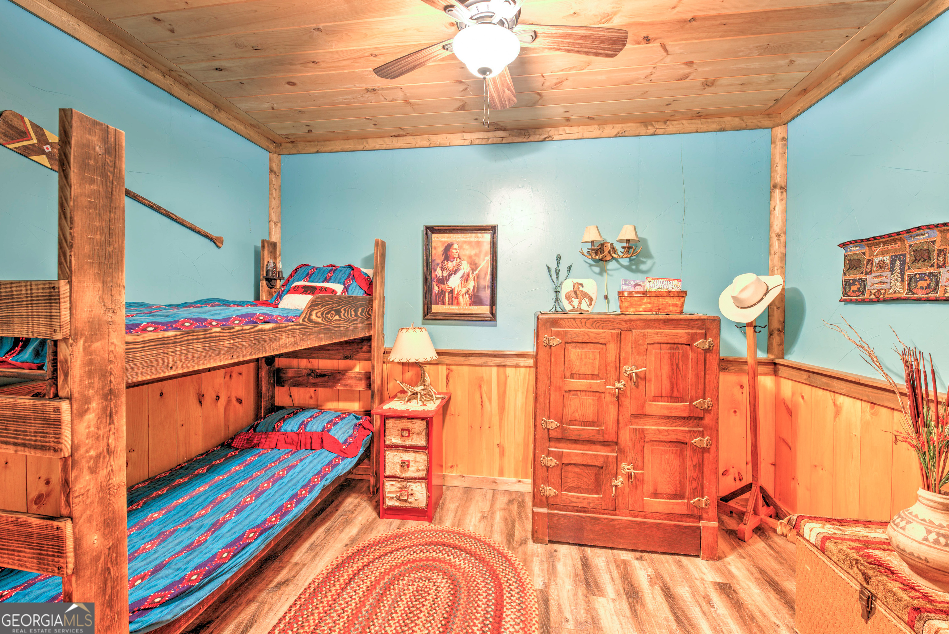 5232 Crow Creek Road Lakemont, GA 30552 - Photo 70 of 90 a bedroom with furniture and a wooden floor