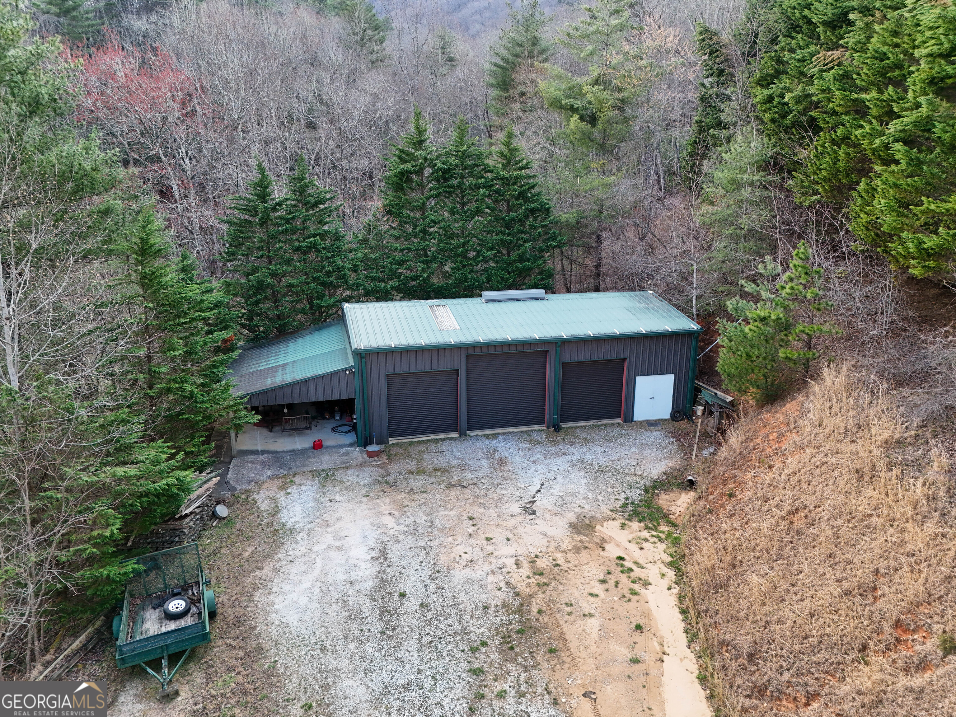 5232 Crow Creek Road Lakemont, GA 30552 - Photo 74 of 90 a backyard of a house with large trees and wooden fence