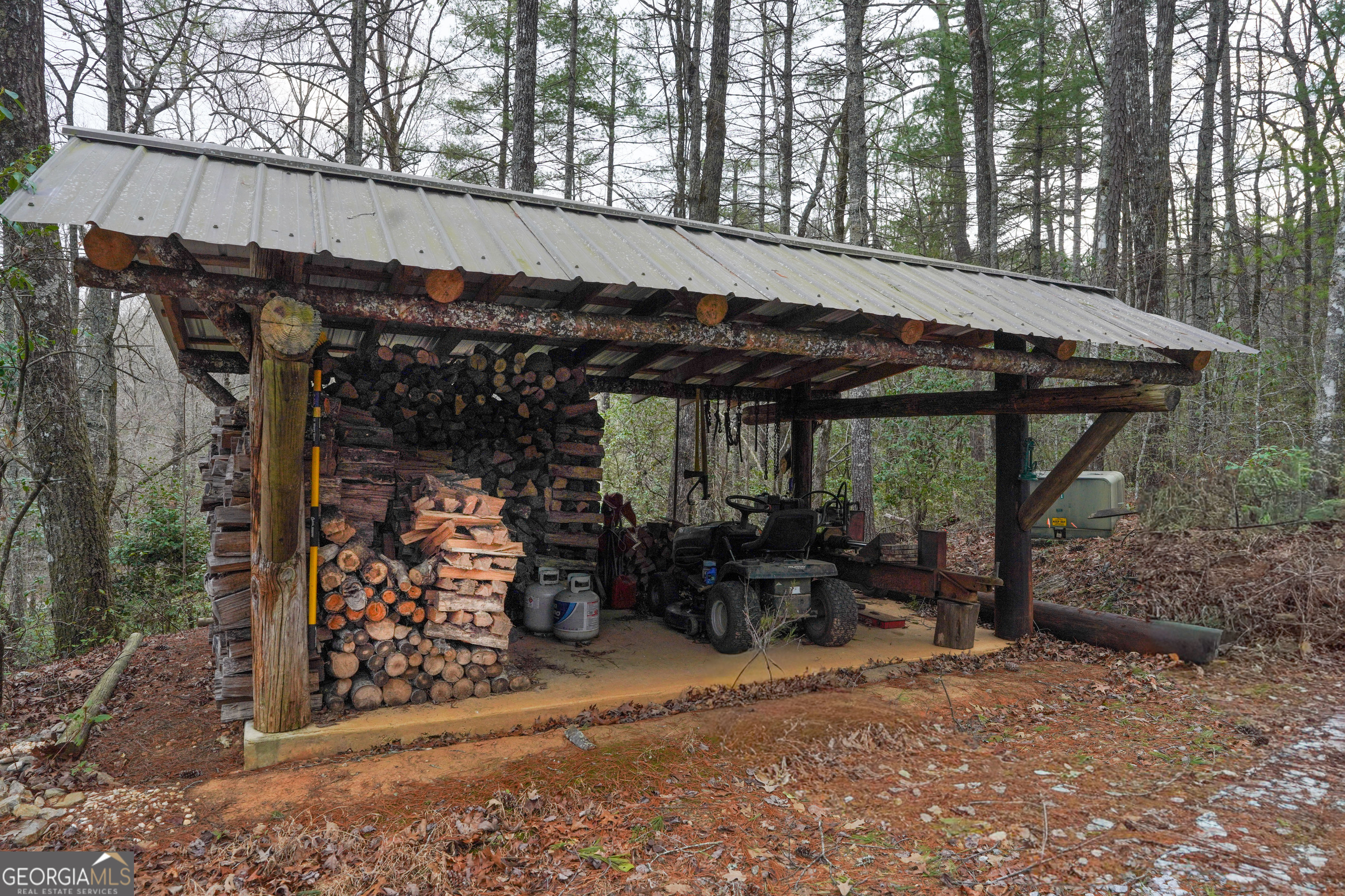 5232 Crow Creek Road Lakemont, GA 30552 - Photo 80 of 90 a view of patio with table and chairs under an umbrella