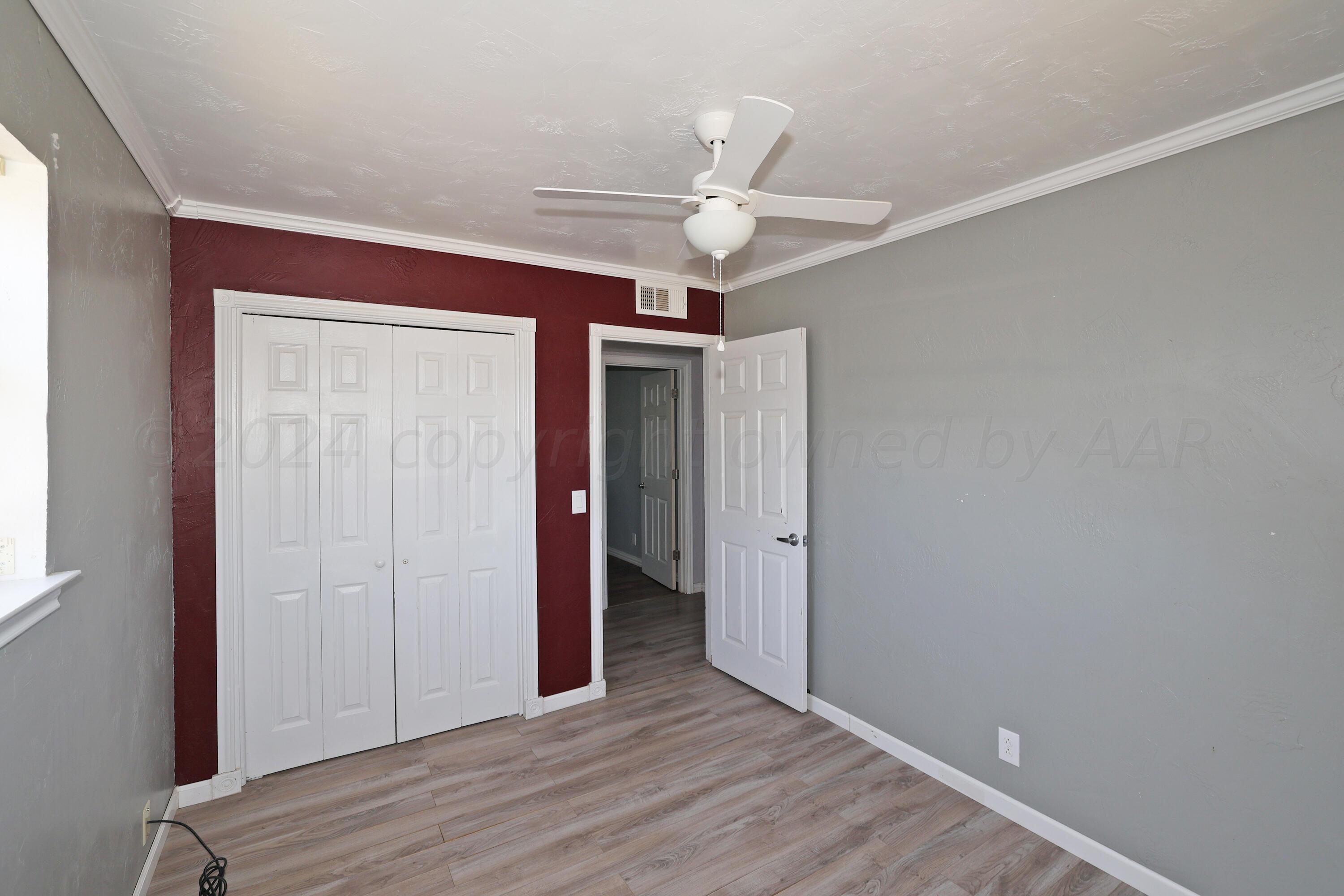 5206 South Travis Street Amarillo, TX 79110 - Photo 15 of 21 wooden floor in an empty room