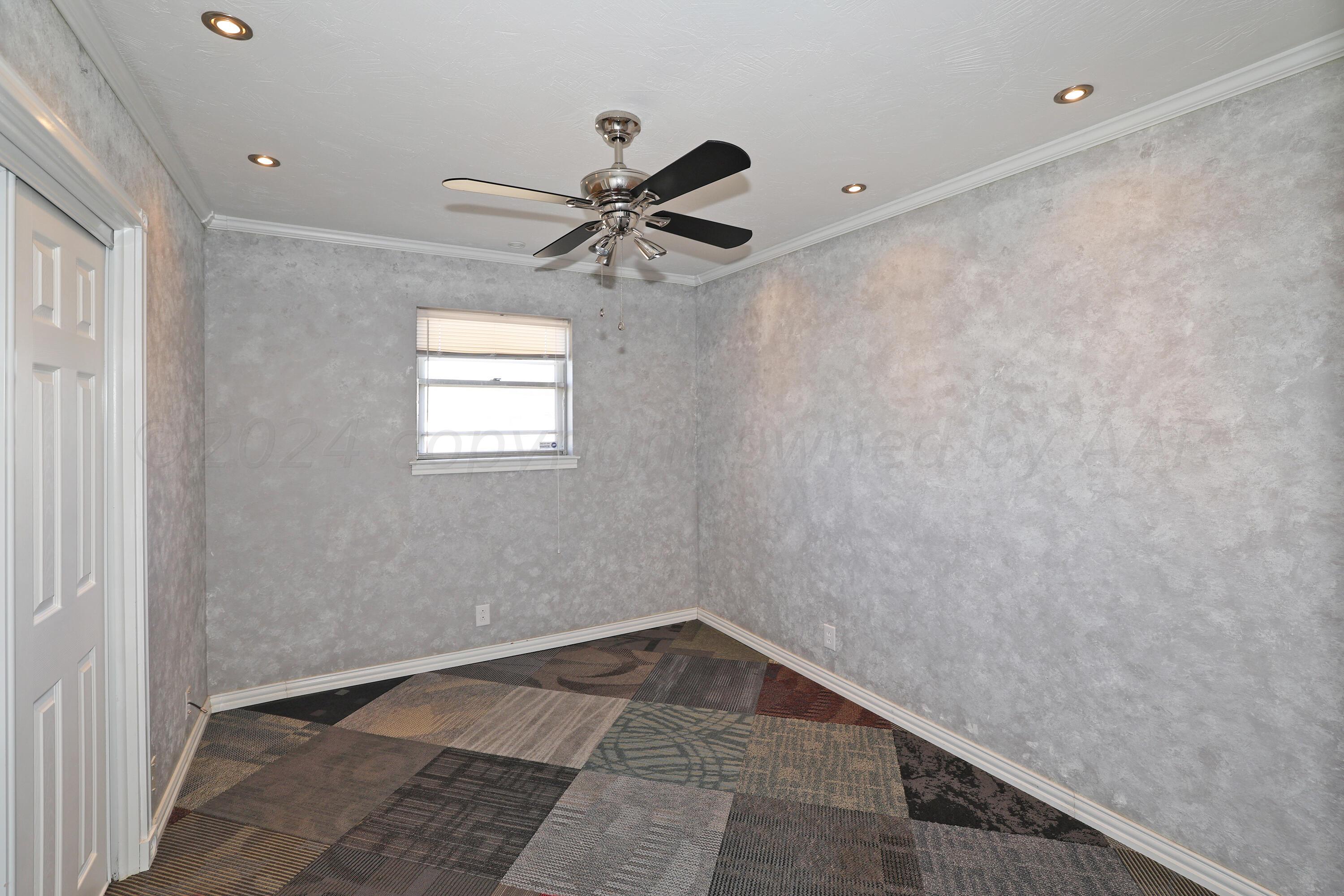 5206 South Travis Street Amarillo, TX 79110 - Photo 16 of 21 a view of a big room with carpet