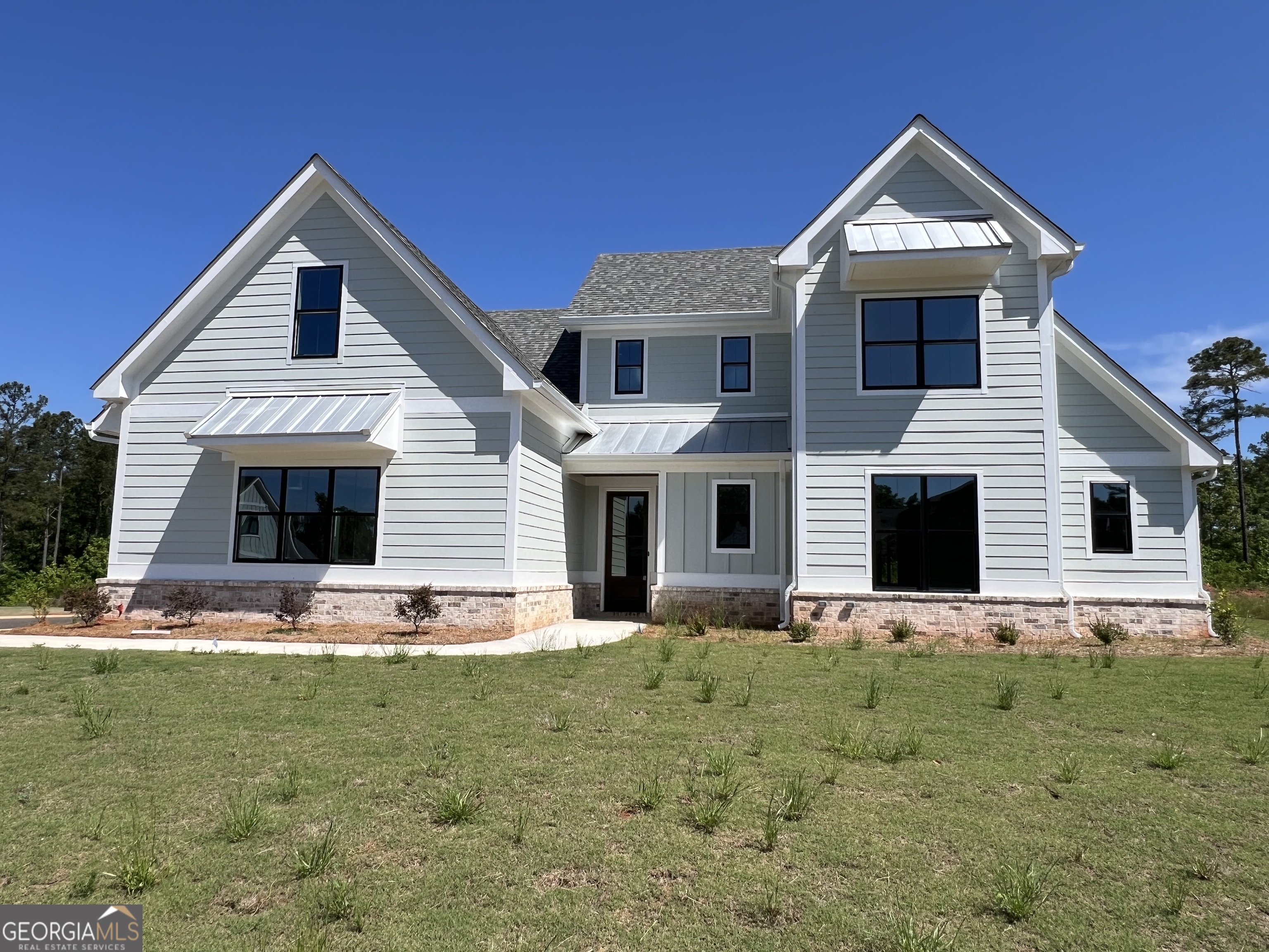 155 Hawthorne Lane Forsyth, GA 31029 - Photo 1 of 46 a front view of house with yard outdoor seating and yard