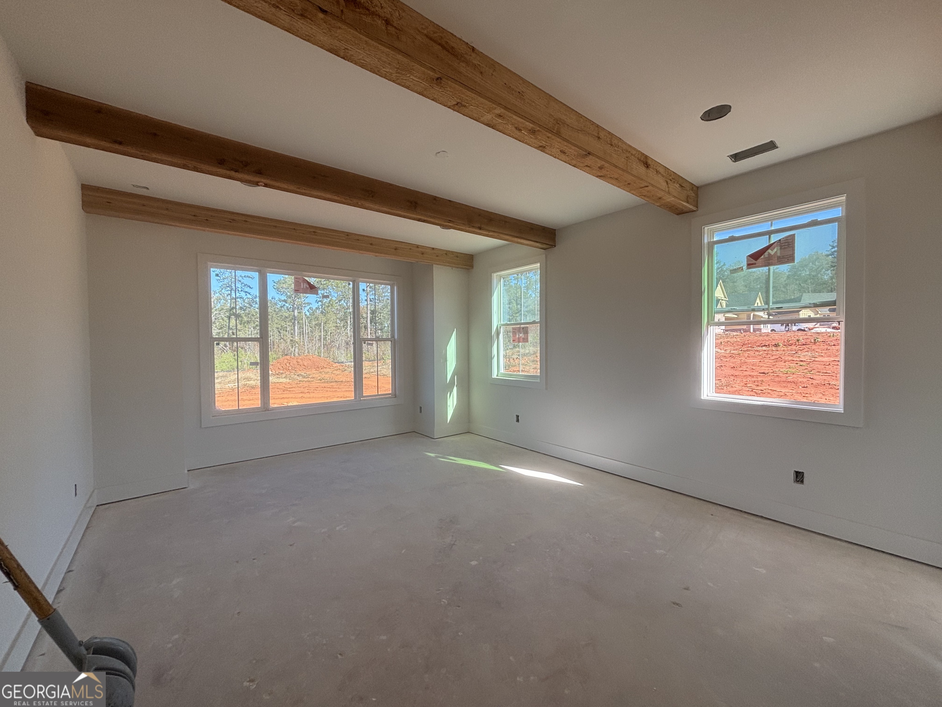 155 Hawthorne Lane Forsyth, GA 31029 - Photo 11 of 22 an empty room with windows