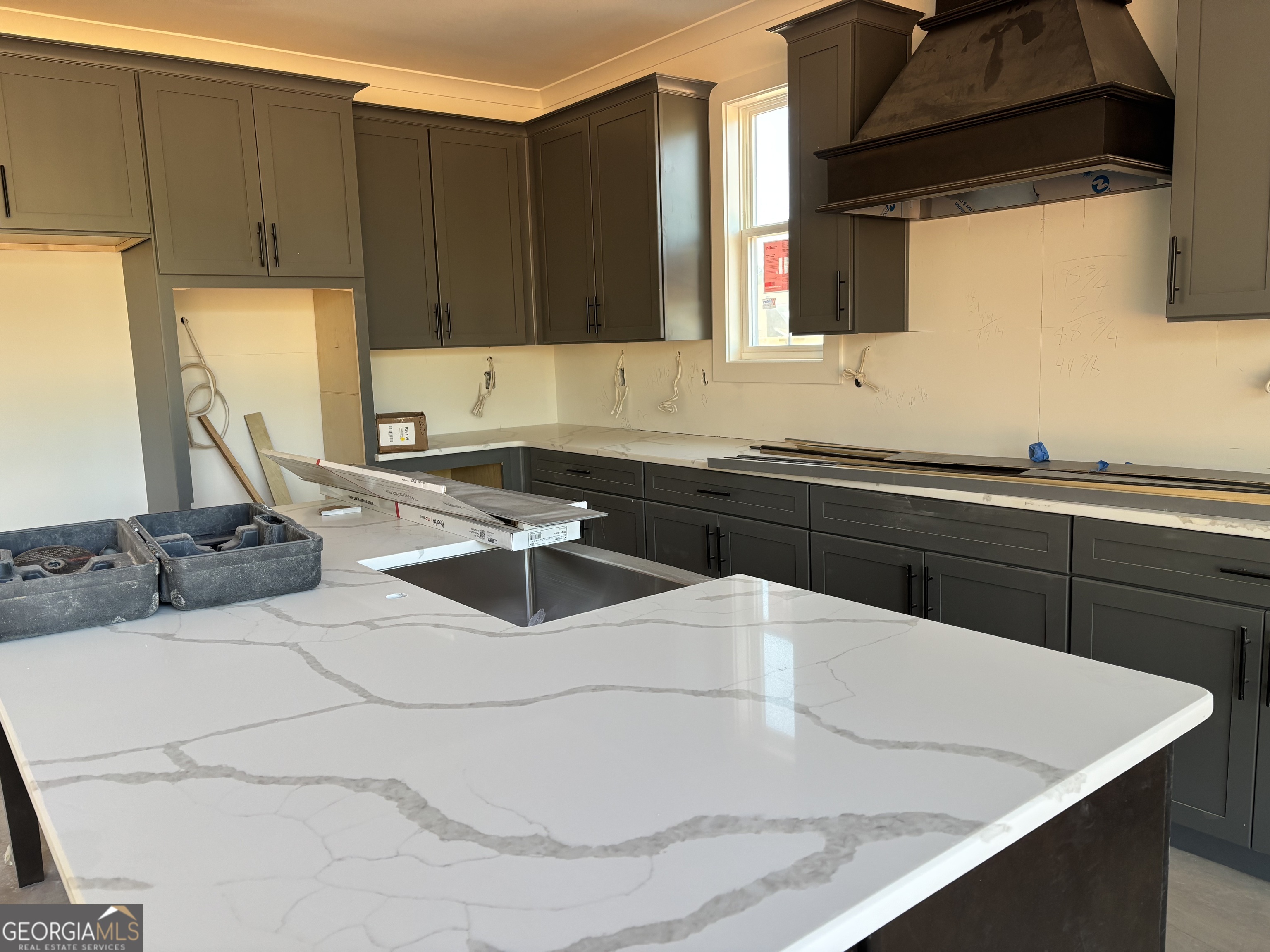 155 Hawthorne Lane Forsyth, GA 31029 - Photo 16 of 22 a kitchen with a sink and a stove top oven