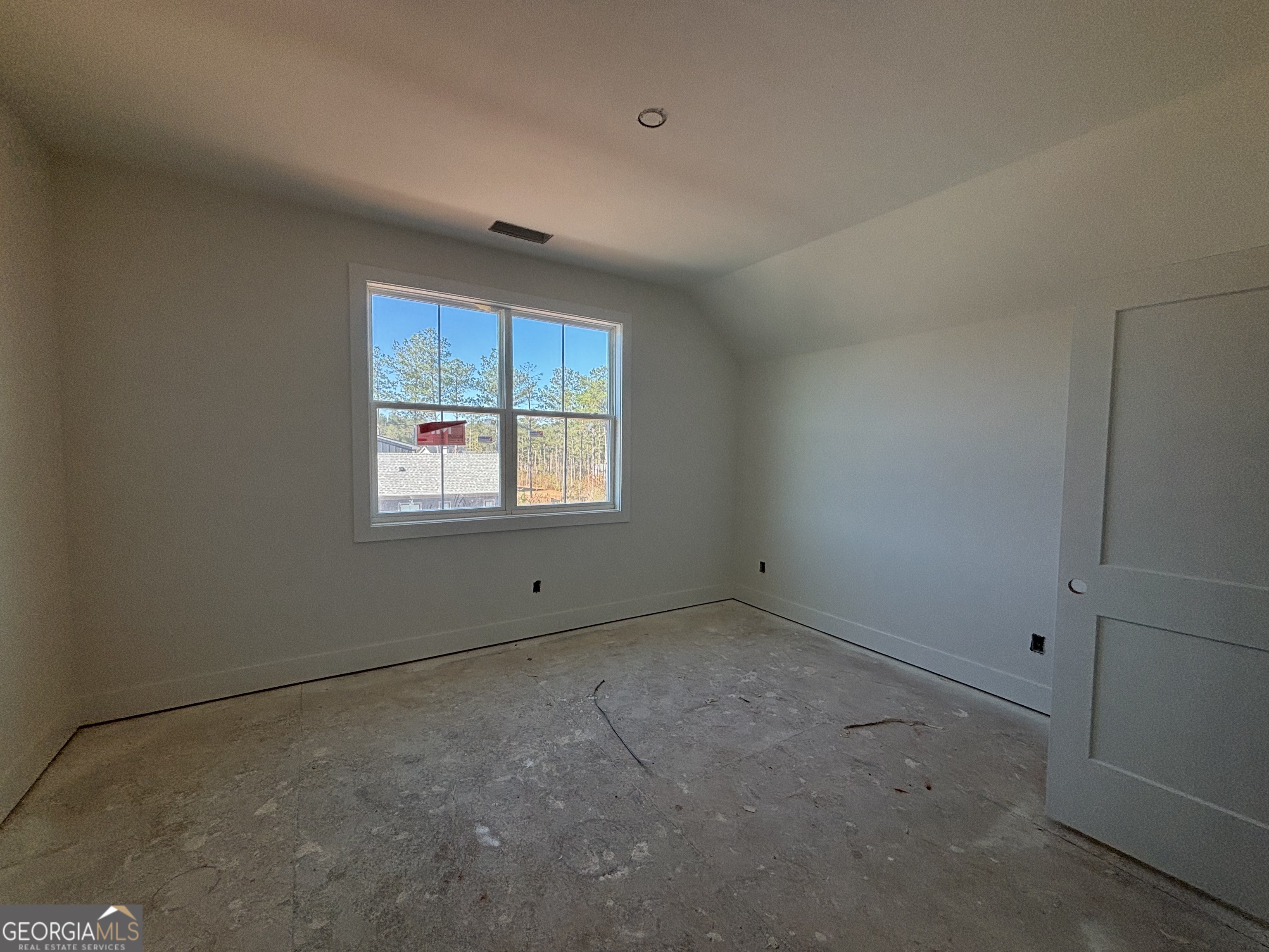 155 Hawthorne Lane Forsyth, GA 31029 - Photo 18 of 22 a view of an empty room with a window