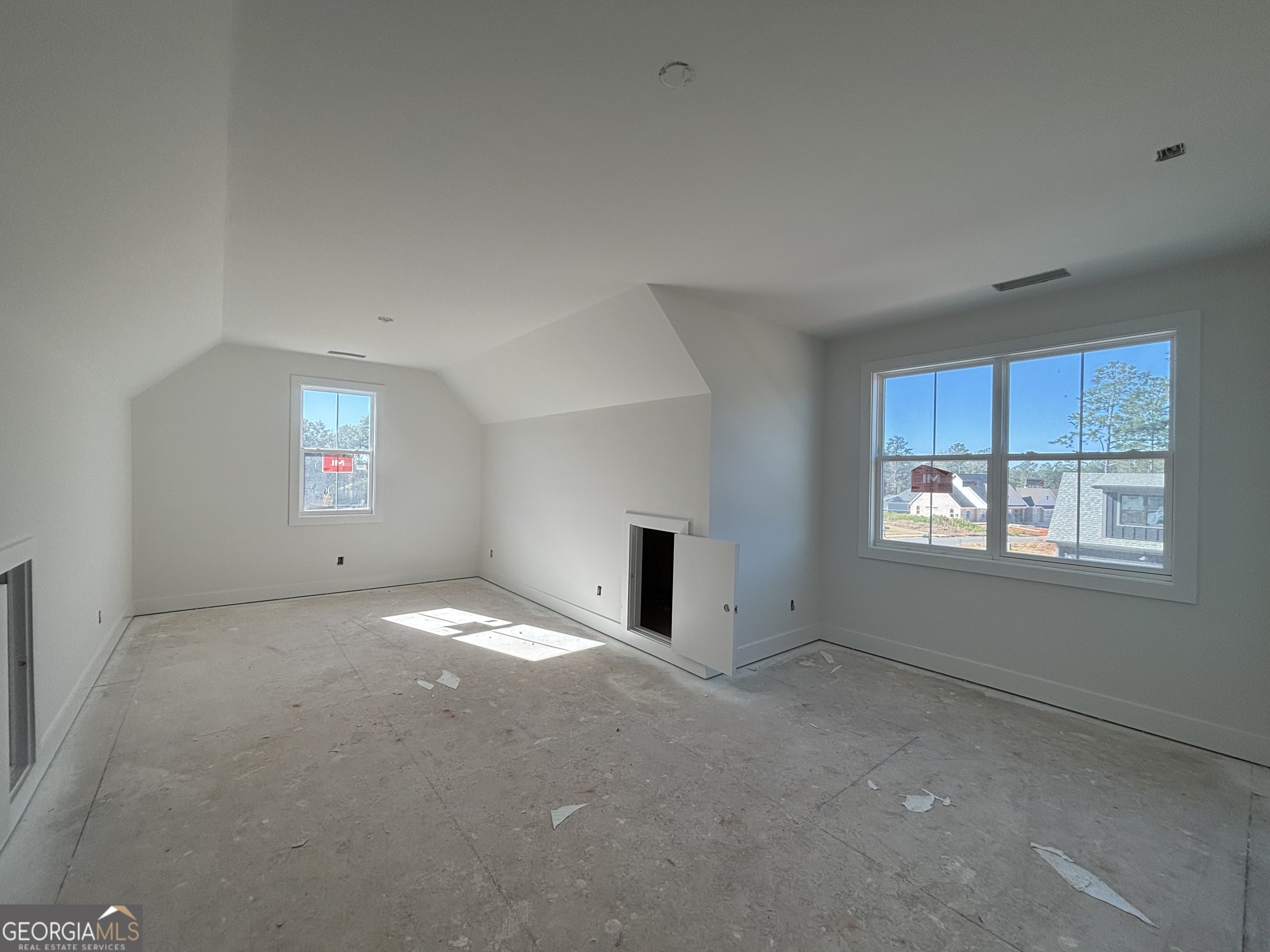 155 Hawthorne Lane Forsyth, GA 31029 - Photo 19 of 22 a view of empty room with windows