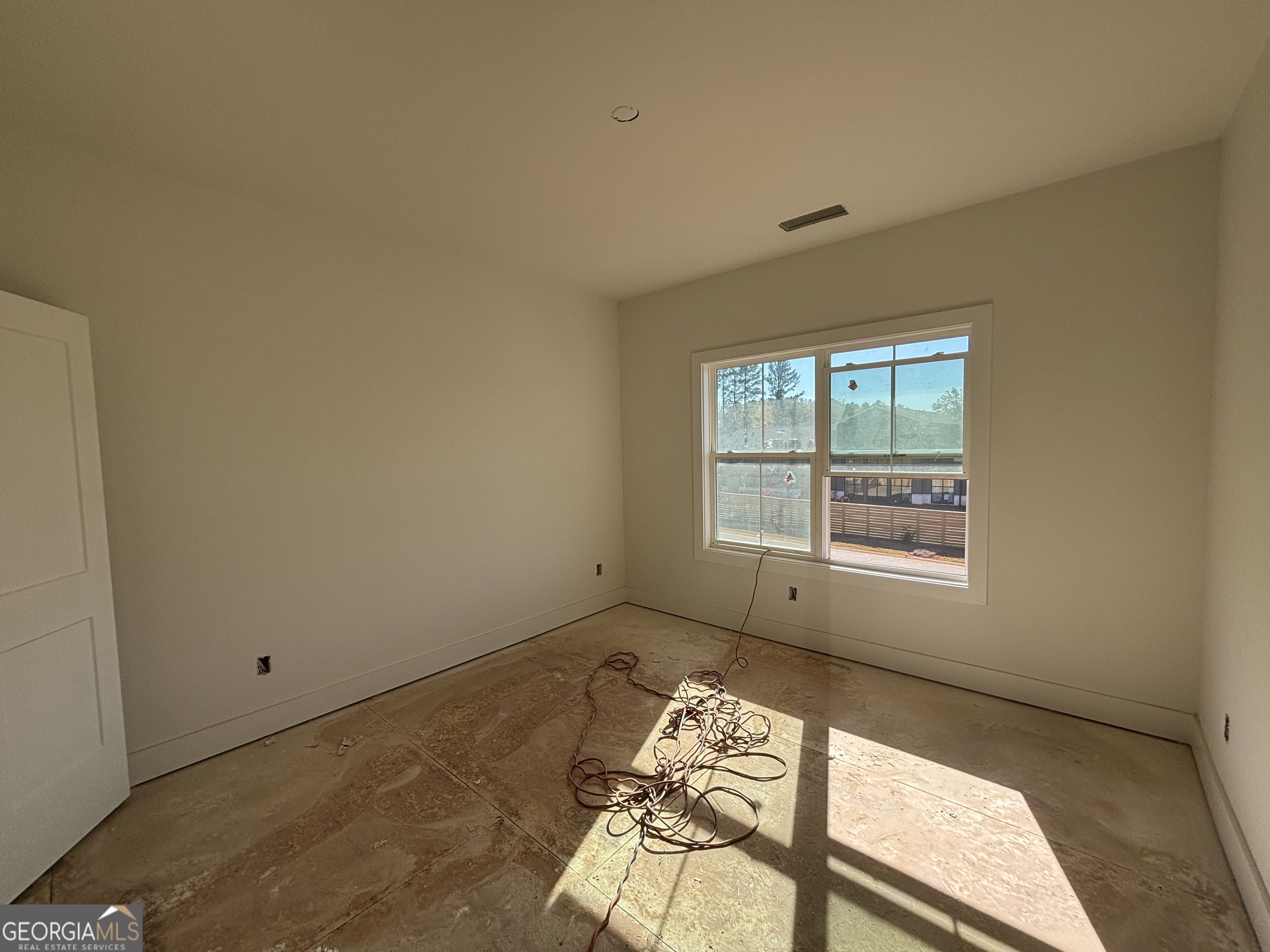 155 Hawthorne Lane Forsyth, GA 31029 - Photo 20 of 22 an empty room with windows