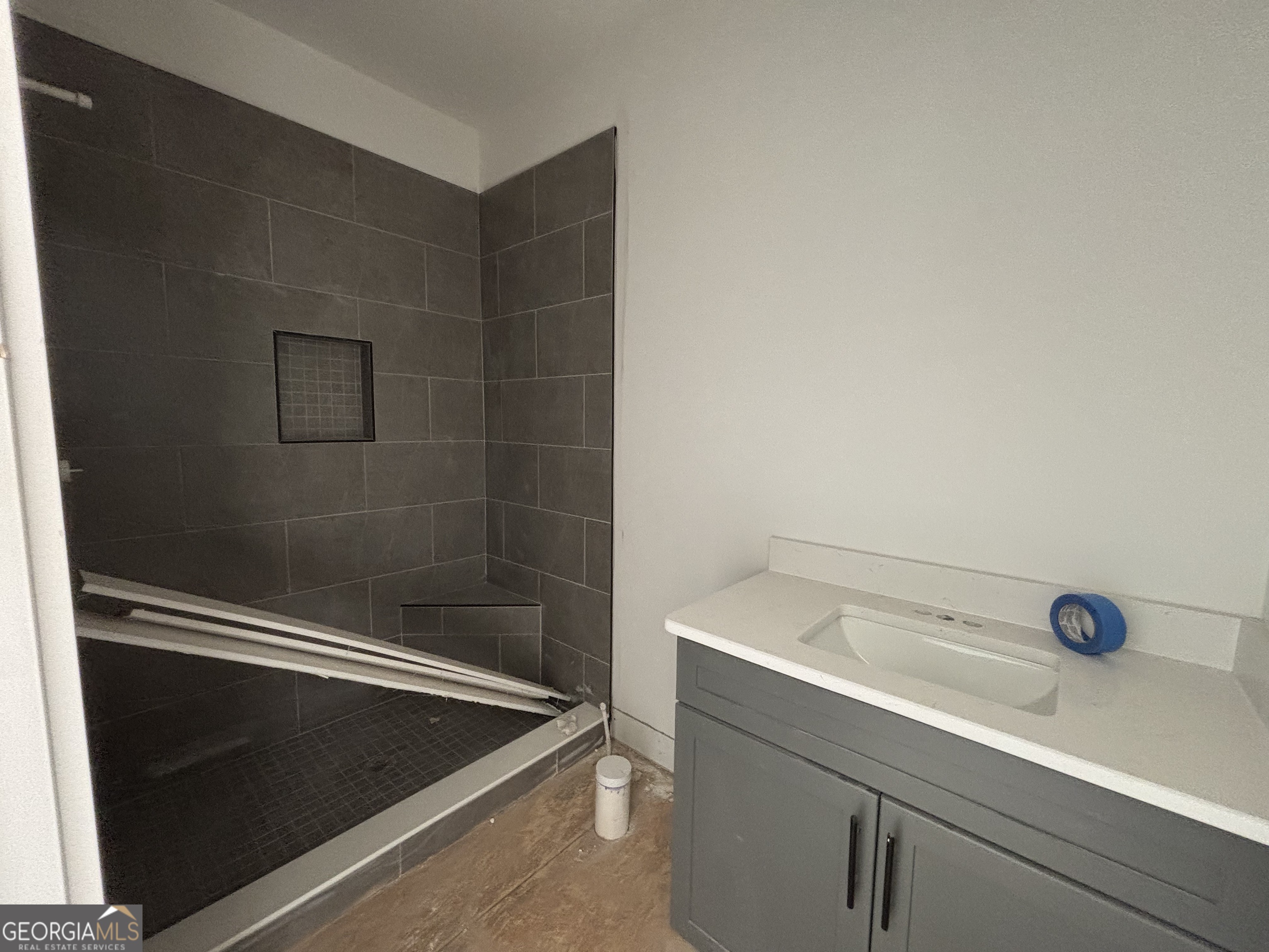 155 Hawthorne Lane Forsyth, GA 31029 - Photo 21 of 22 a bathroom with a tub and sink