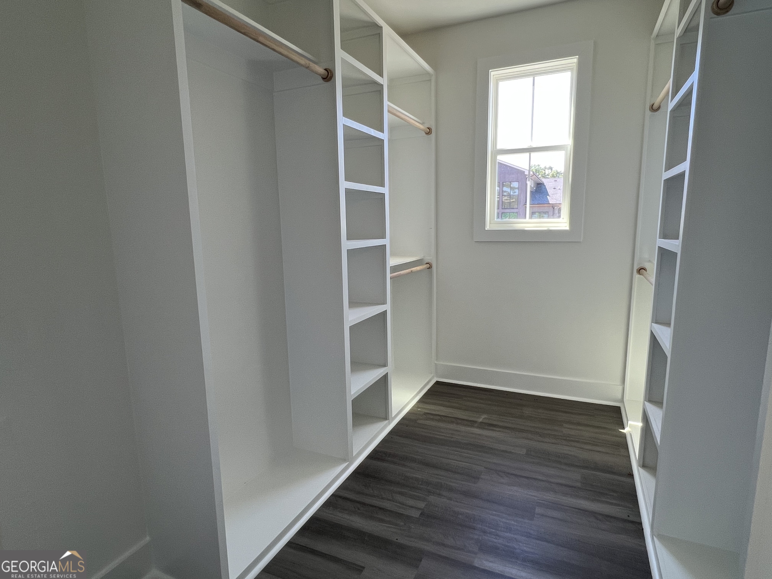 155 Hawthorne Lane Forsyth, GA 31029 - Photo 26 of 46 a view of an empty room with wooden floor and a window