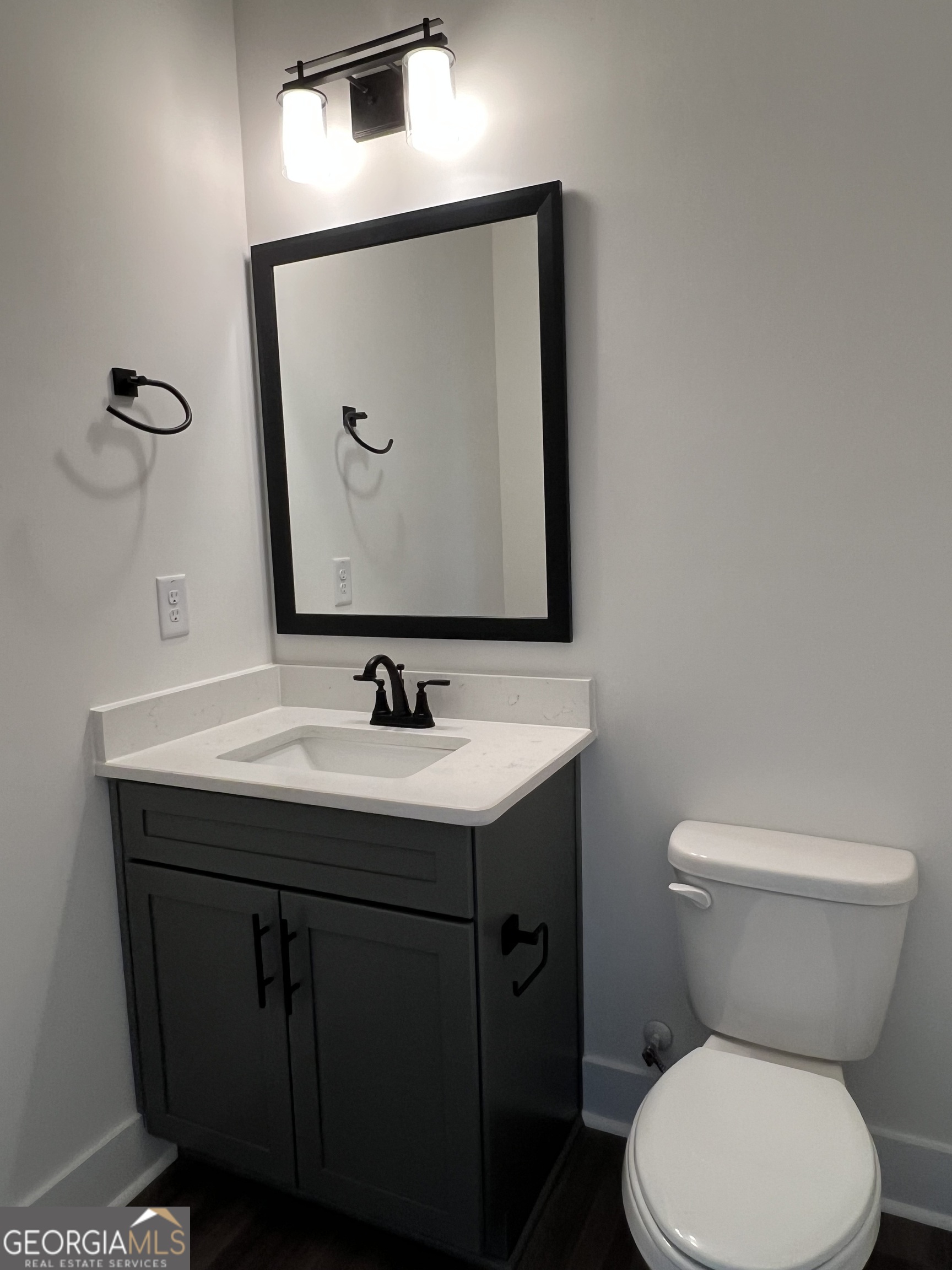 155 Hawthorne Lane Forsyth, GA 31029 - Photo 27 of 46 a bathroom with a toilet sink and mirror
