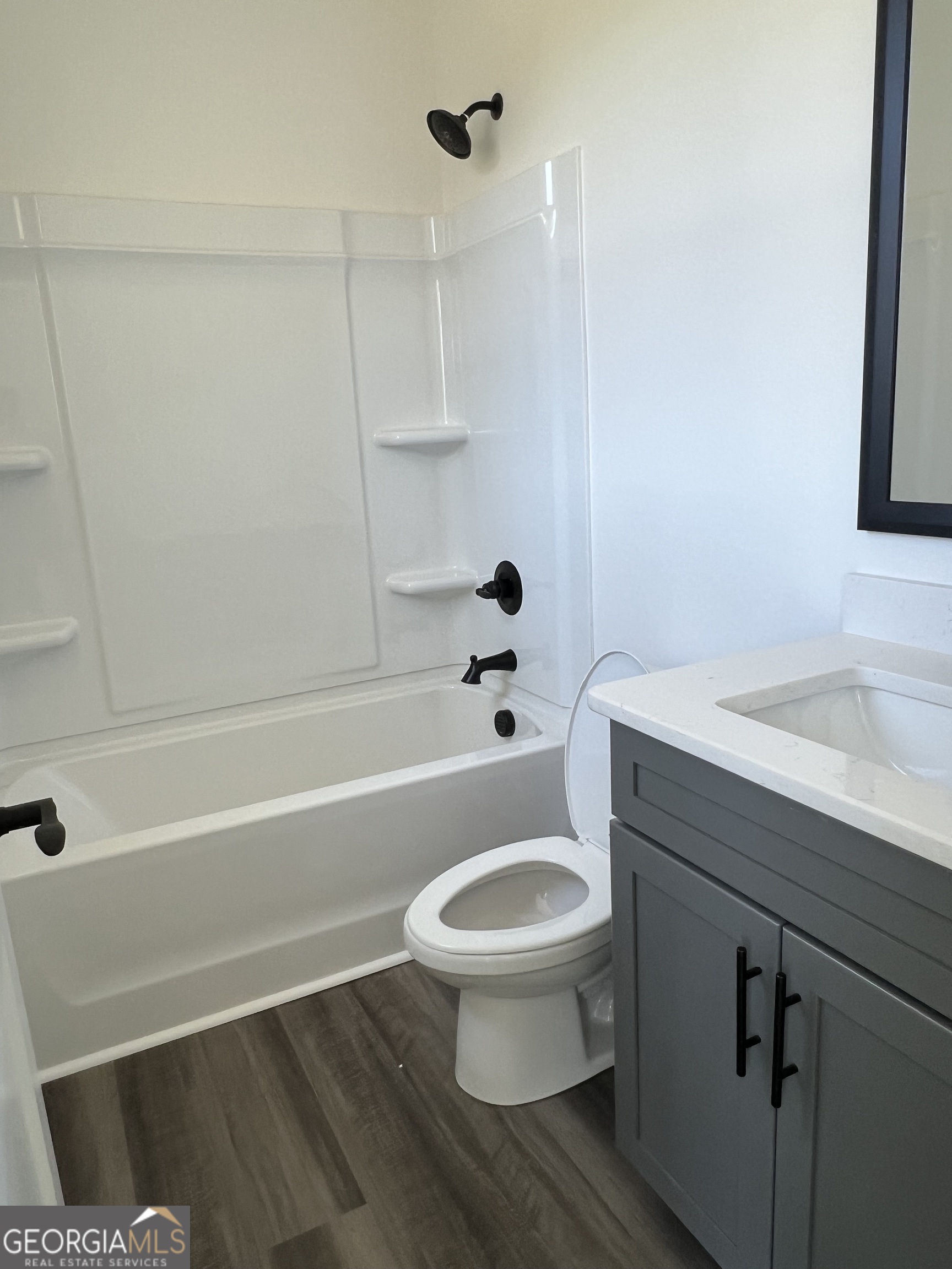 155 Hawthorne Lane Forsyth, GA 31029 - Photo 28 of 46 a bathroom with a sink a toilet and a bathtub
