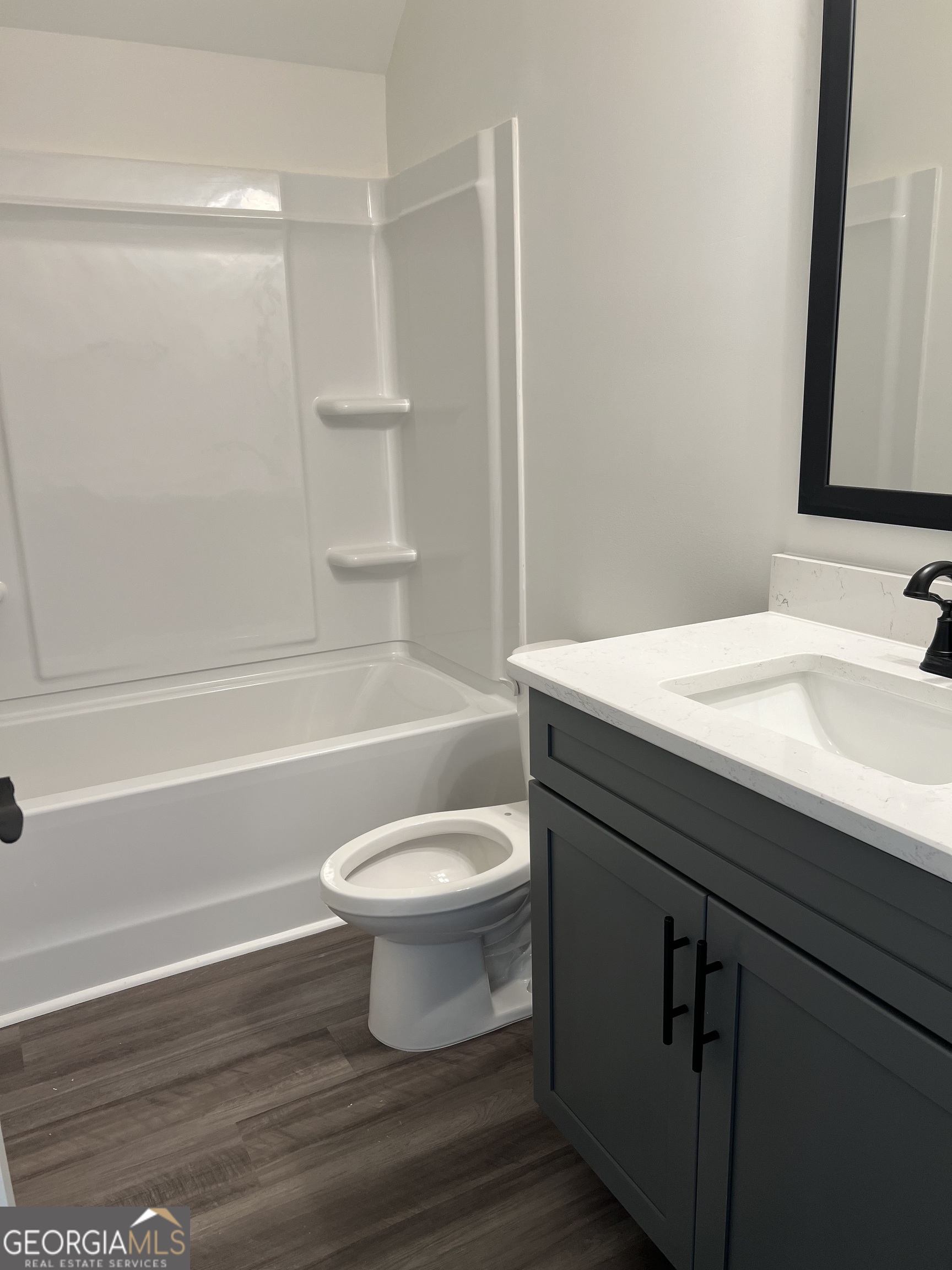 155 Hawthorne Lane Forsyth, GA 31029 - Photo 35 of 46 a bathroom with a sink a toilet and shower
