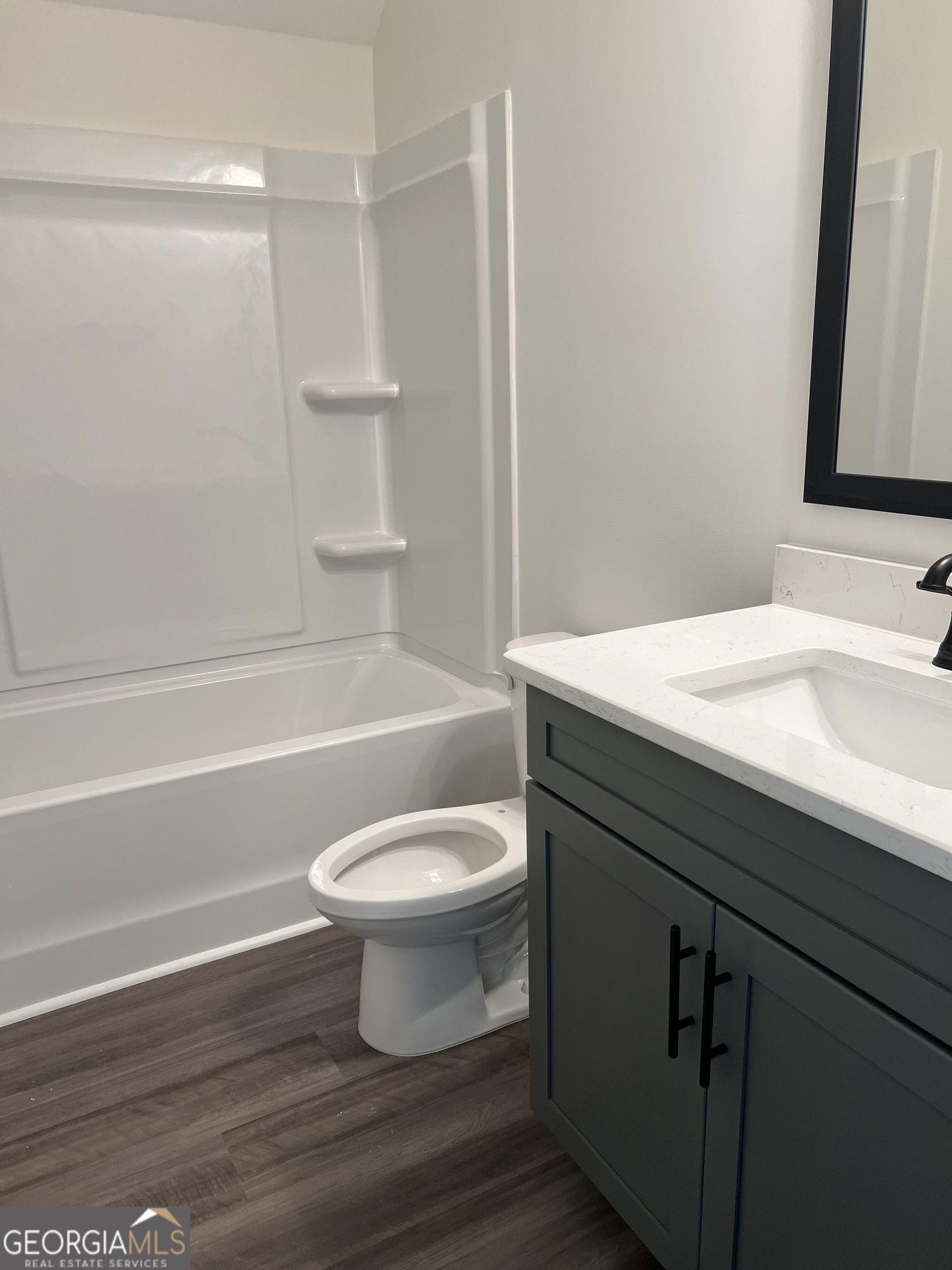 155 Hawthorne Lane Forsyth, GA 31029 - Photo 36 of 46 a bathroom with a sink a toilet and shower