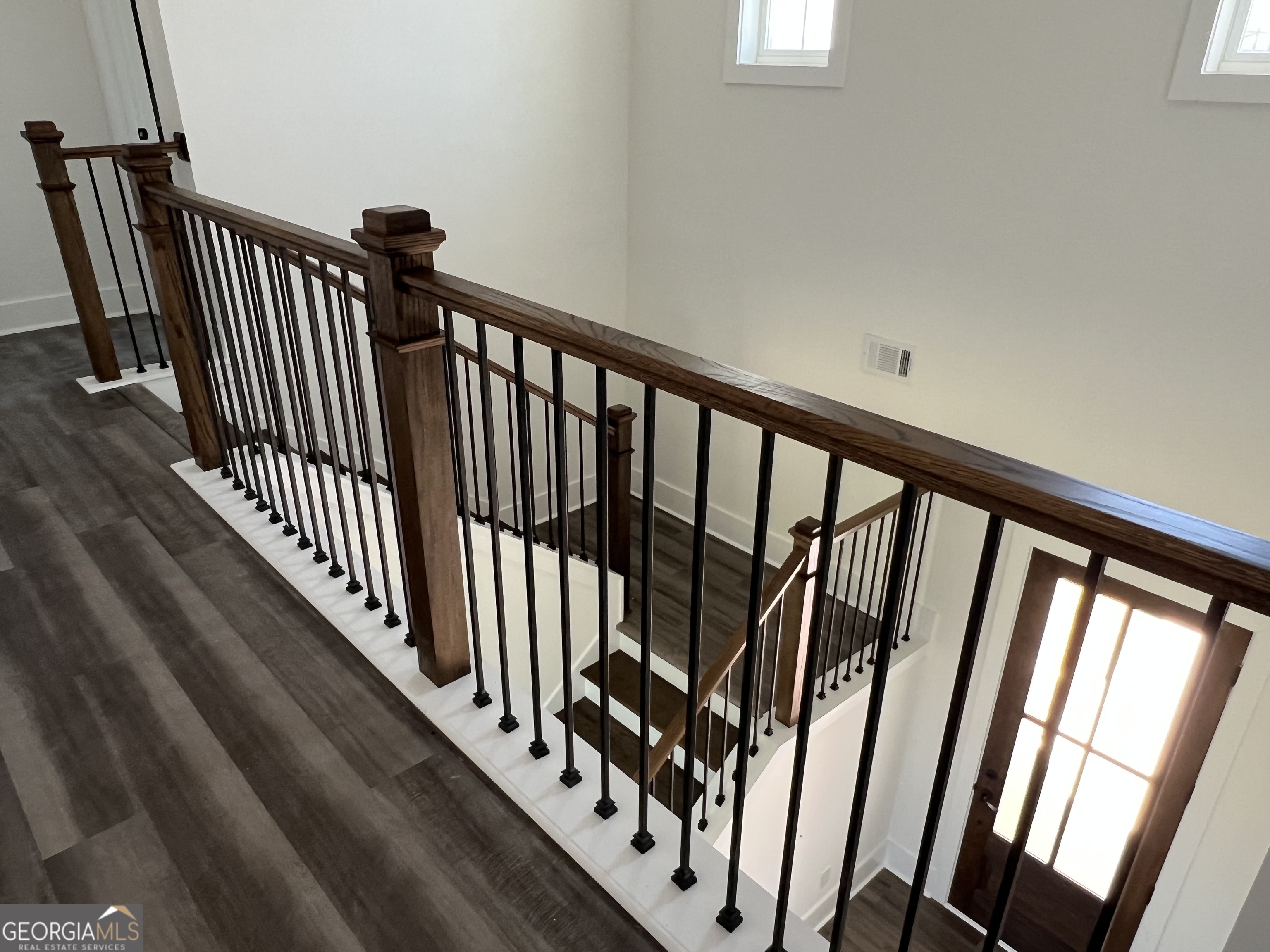 155 Hawthorne Lane Forsyth, GA 31029 - Photo 40 of 46 a view of a hallway with wooden floor