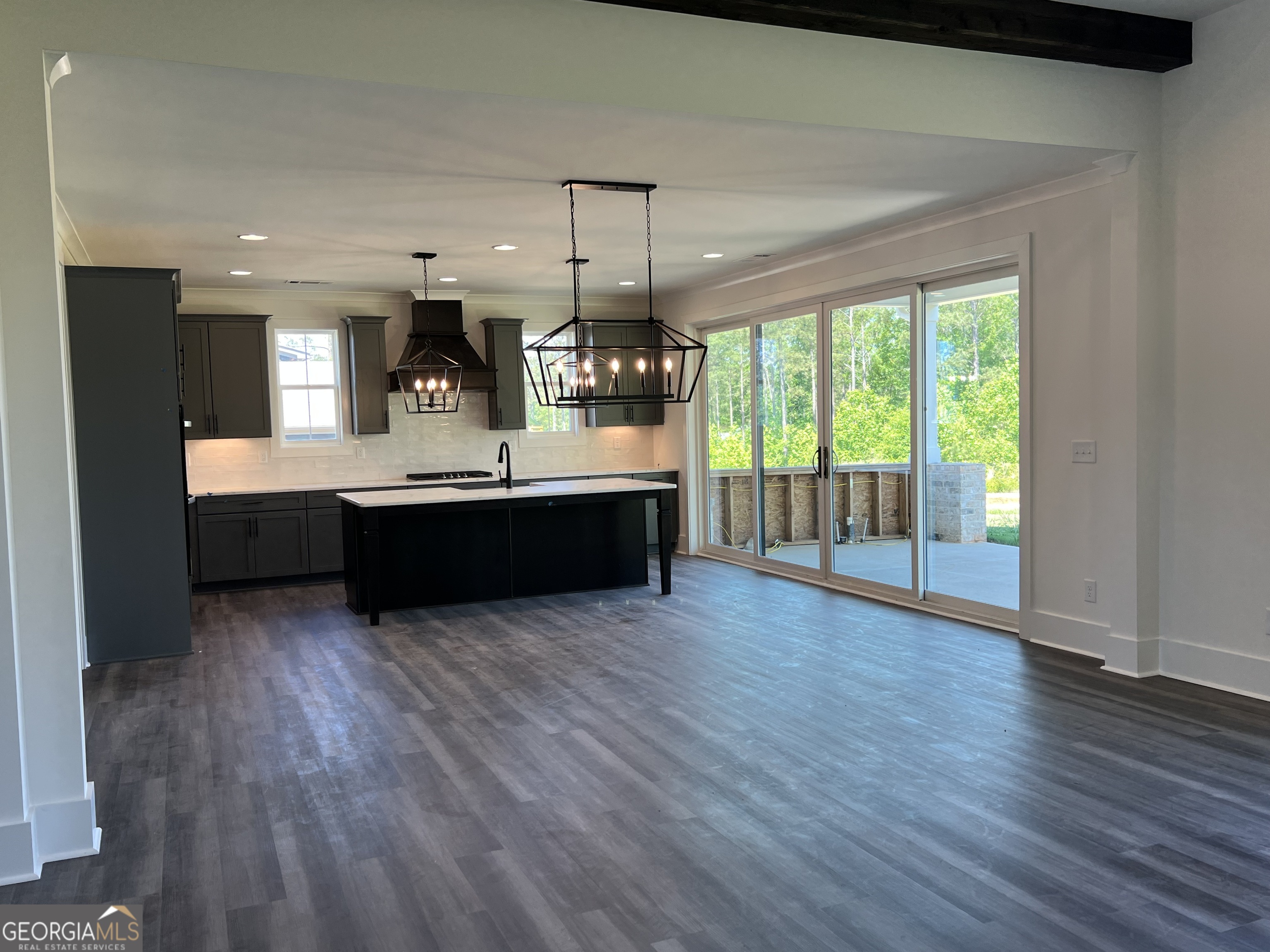 155 Hawthorne Lane Forsyth, GA 31029 - Photo 5 of 46 a view of kitchen and wooden floor