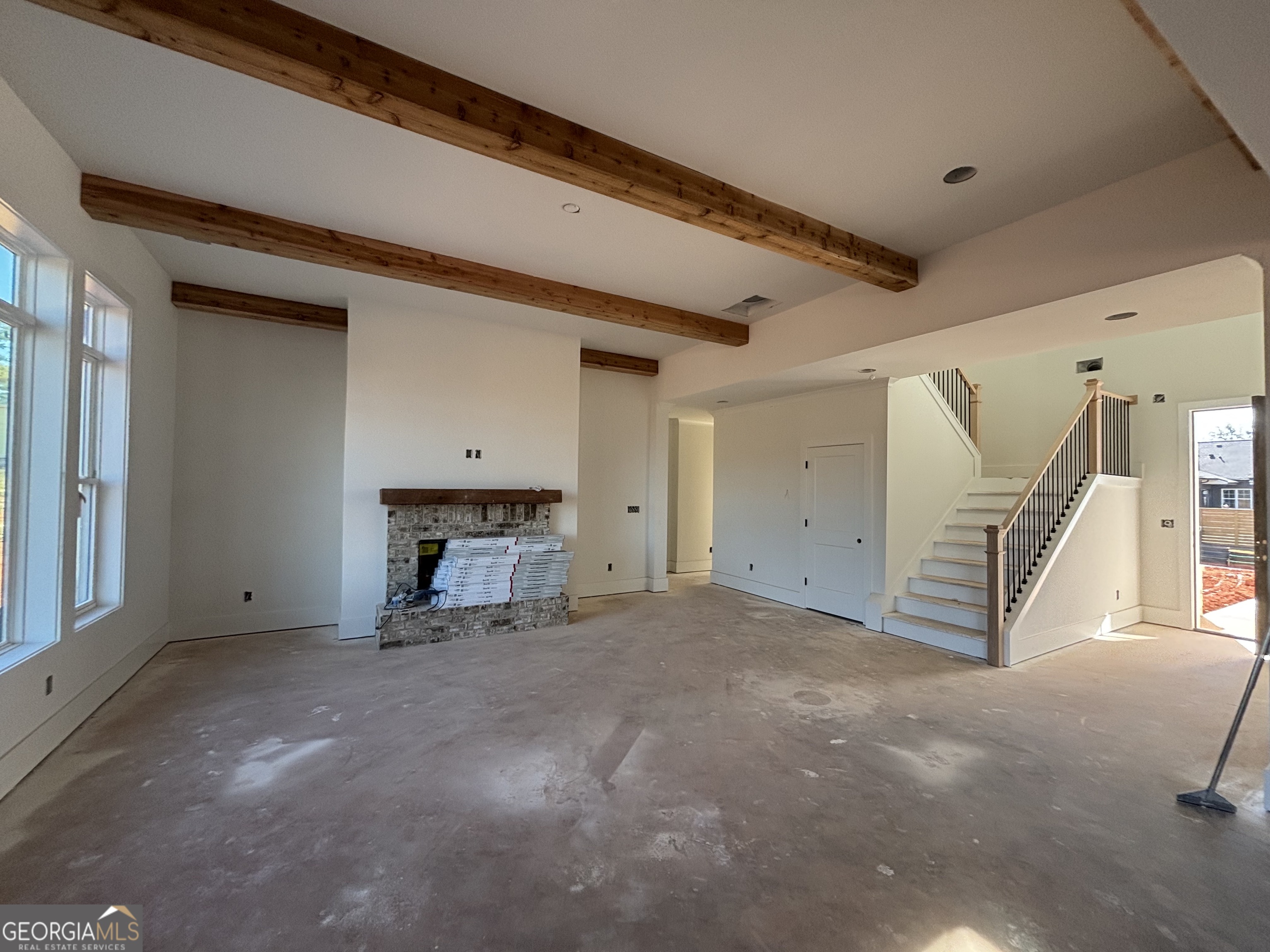 155 Hawthorne Lane Forsyth, GA 31029 - Photo 6 of 22 a view of a livingroom with a fireplace
