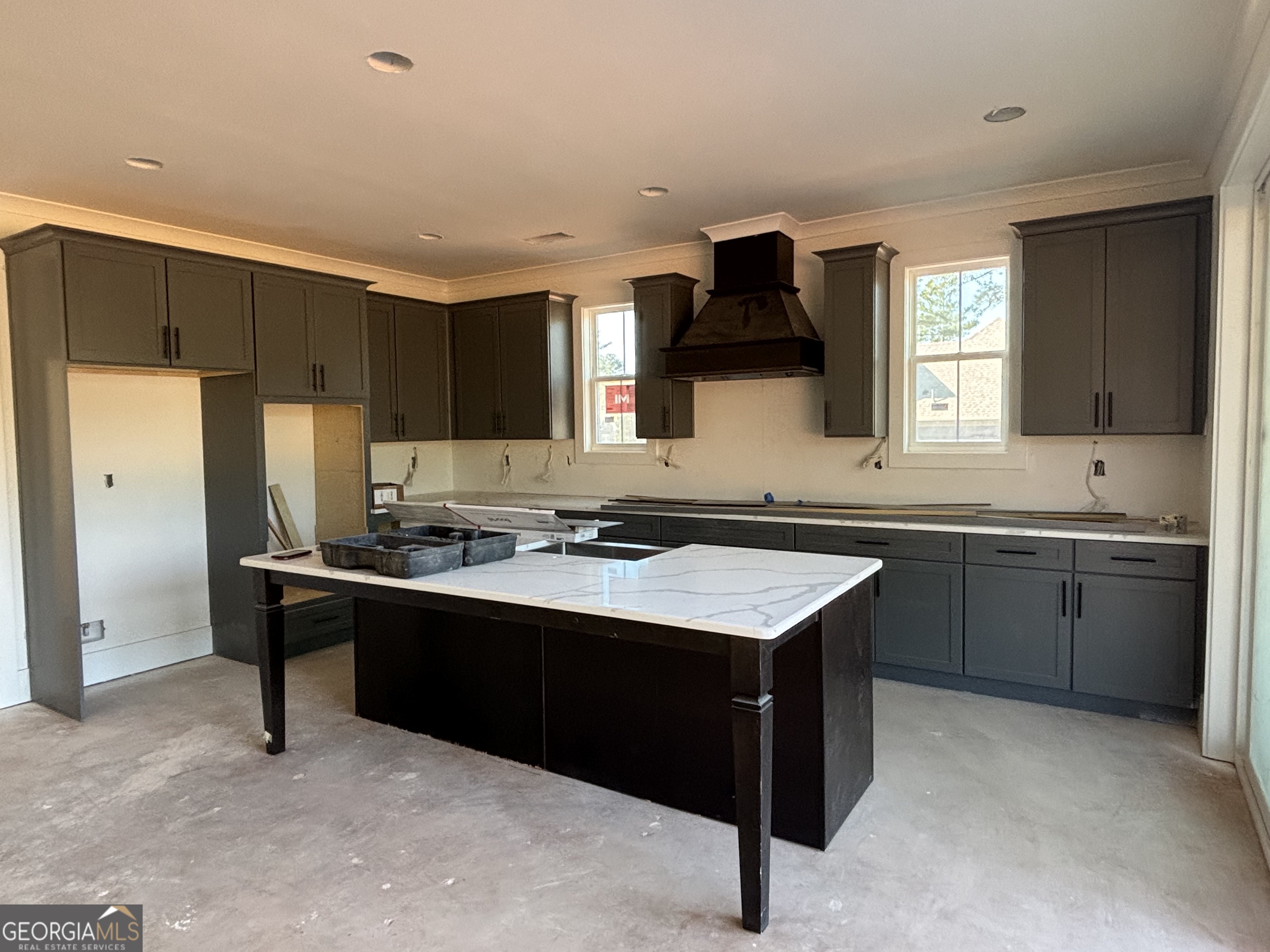 155 Hawthorne Lane Forsyth, GA 31029 - Photo 7 of 22 a kitchen with a sink stove and refrigerator