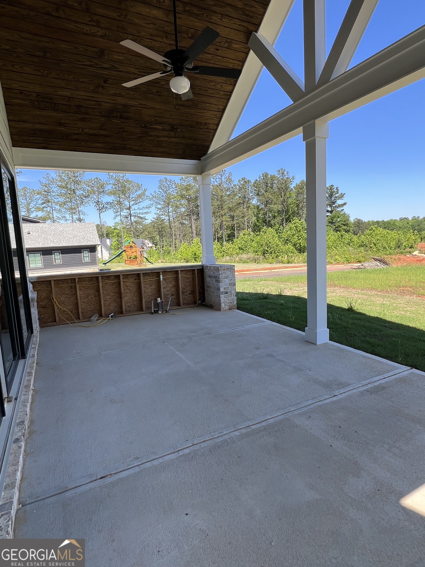 155 Hawthorne Lane Forsyth, GA 31029 - Photo 9 of 46 a view of an outdoor space with a floor to ceiling window and an outdoor view
