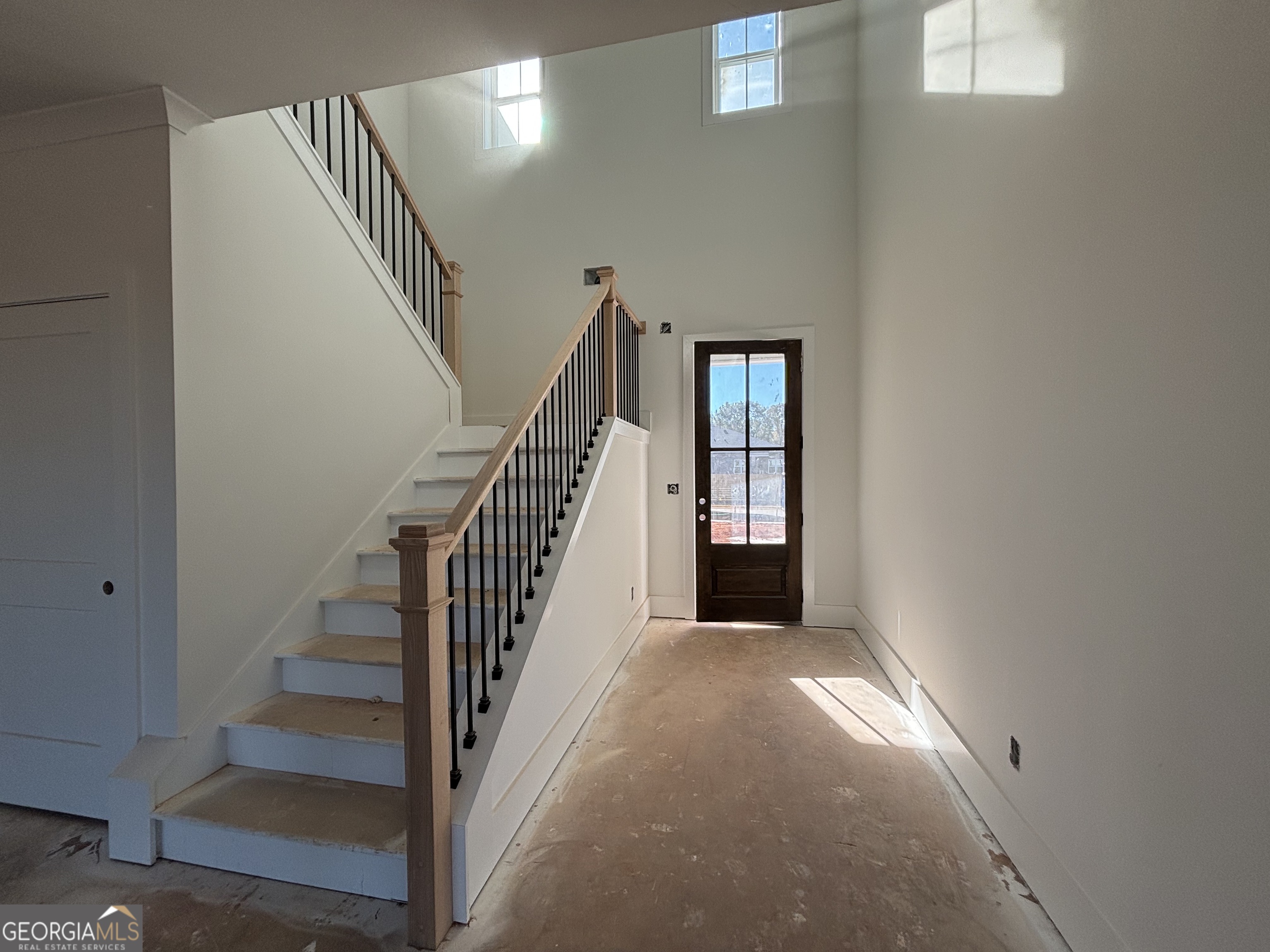 155 Hawthorne Lane Forsyth, GA 31029 - Photo 10 of 22 a view of a hallway with staircase