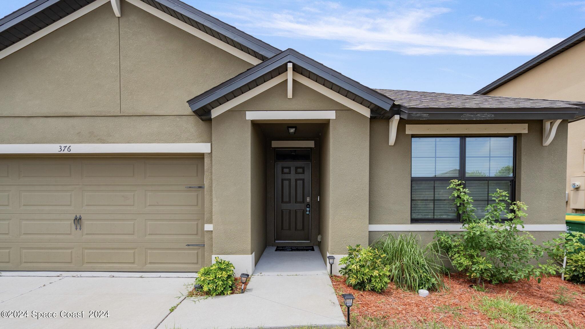 376 Snook Place Cocoa, FL 32927 - Photo 1 of 26 a front view of a house