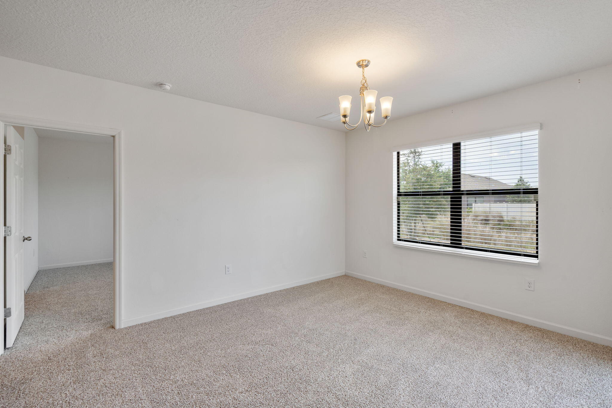 376 Snook Place Cocoa, FL 32927 - Photo 11 of 26 a view of an empty room with a window