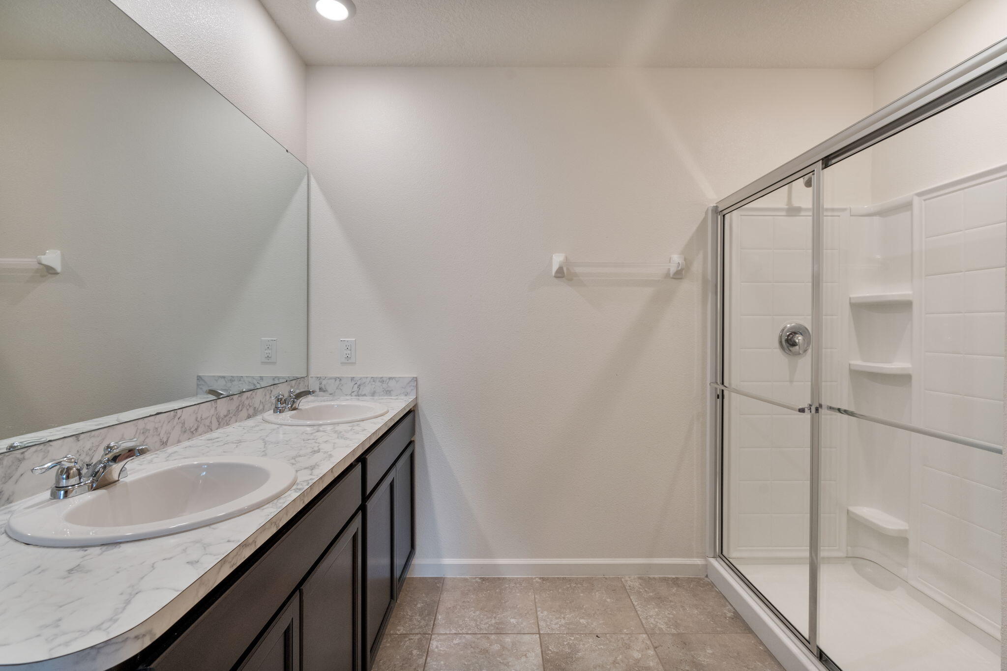 376 Snook Place Cocoa, FL 32927 - Photo 15 of 26 a bathroom with a granite countertop sink a mirror and shower