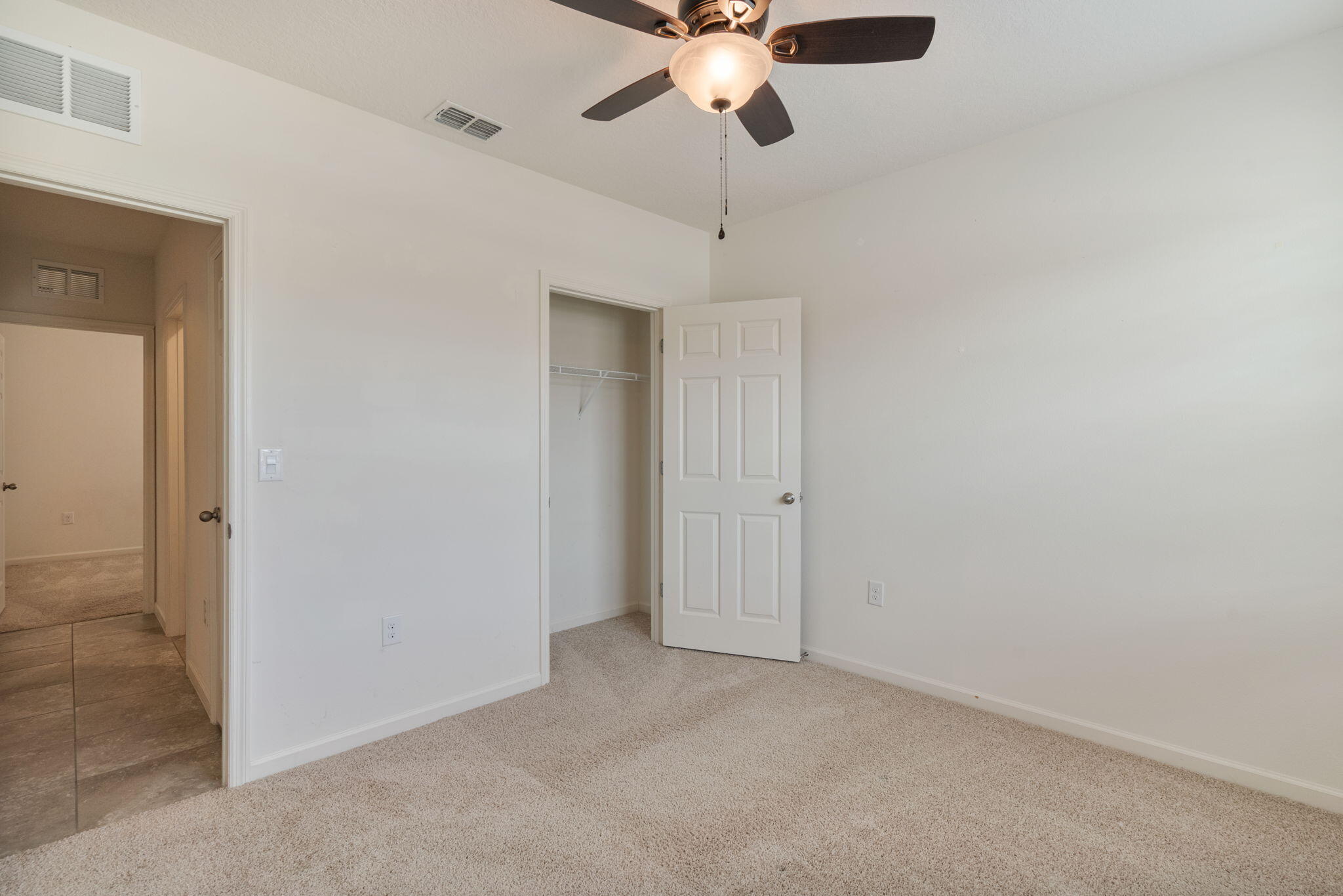 376 Snook Place Cocoa, FL 32927 - Photo 18 of 26 a view of an empty room and chandelier fan