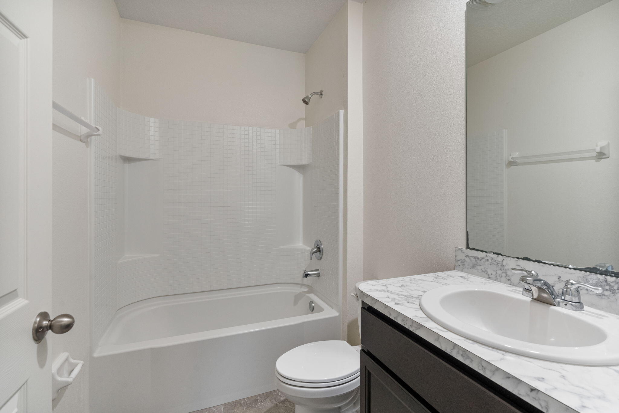 376 Snook Place Cocoa, FL 32927 - Photo 23 of 26 a bathroom with a granite countertop sink toilet and shower